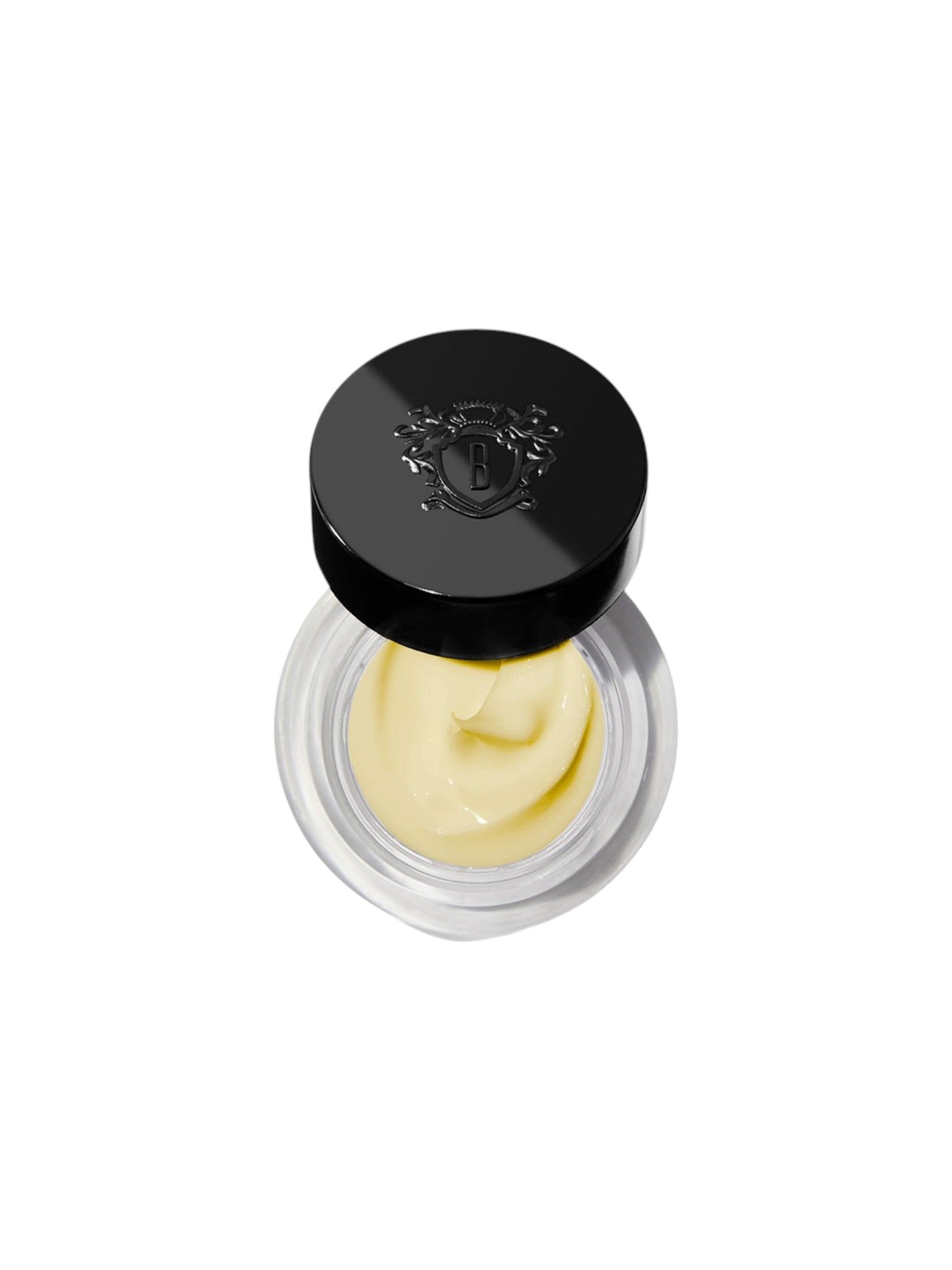 Cosmetic cream in a round container with a black lid on a white background. Bobbi Brown, Monza Outlet, Monza Fashion, Shein Outlet