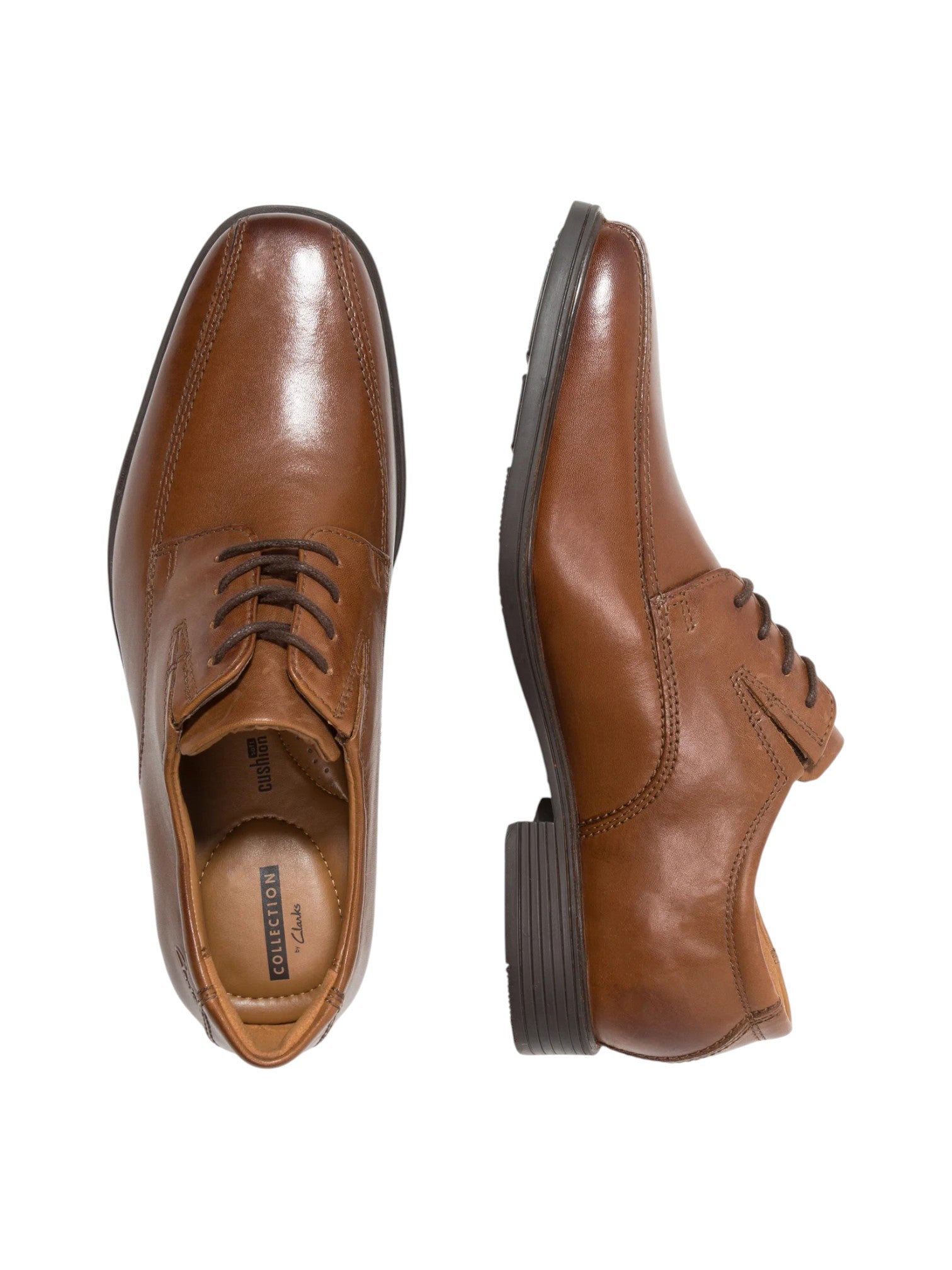 Pair of brown dress shoes on a white background. Clarks, Monza Outlet, Monza Fashion, Shein Outlet
