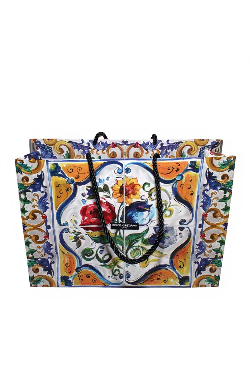 Colorful decorative bag with floral design and brand logo on a white background. Dolce & Gabbana, Monza Outlet, Monza Fashion, Shein Outlet