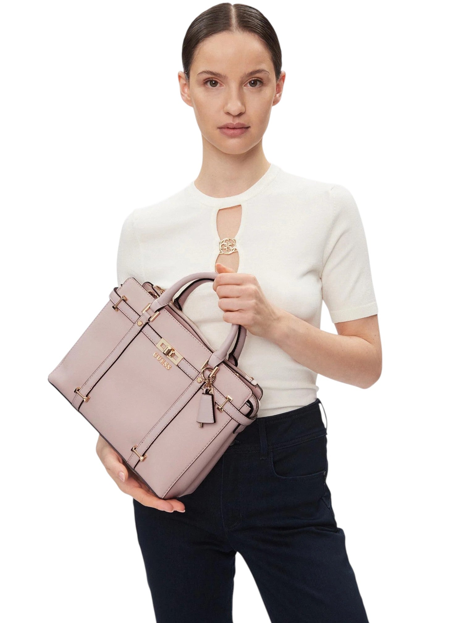 Woman holding a pink briefcase against a white background. Guess, Monza Outlet, Monza Fashion, Shein Outlet