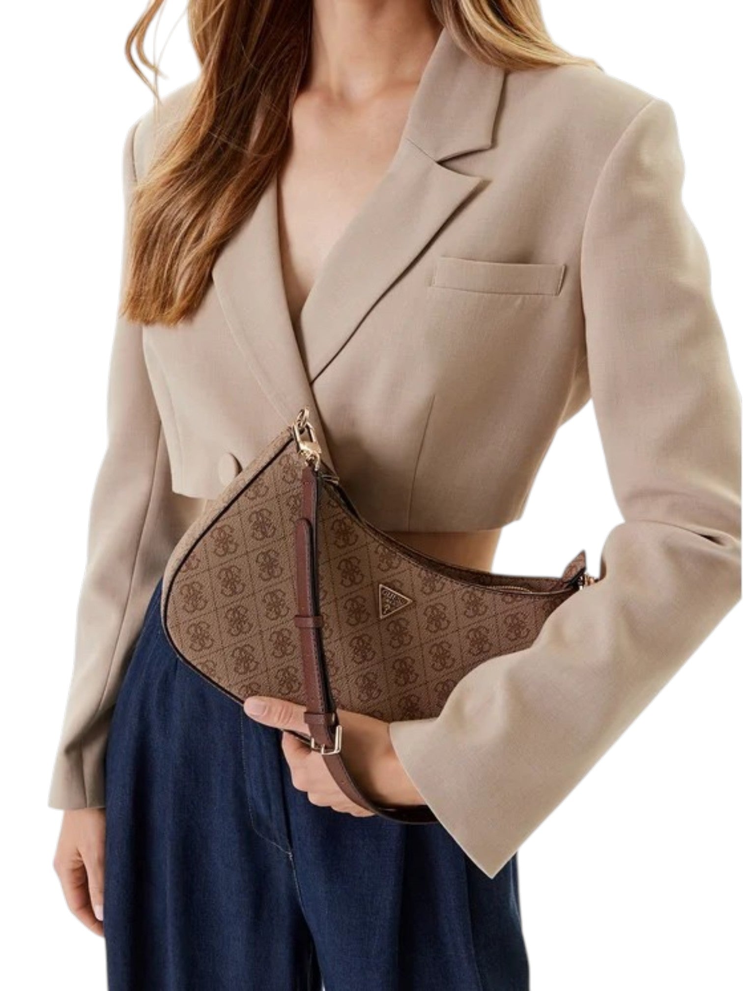 Person holding a brown patterned handbag with a beige blazer and navy pants on a white background. Guess, Monza Outlet, Monza Fashion, Shein Outlet