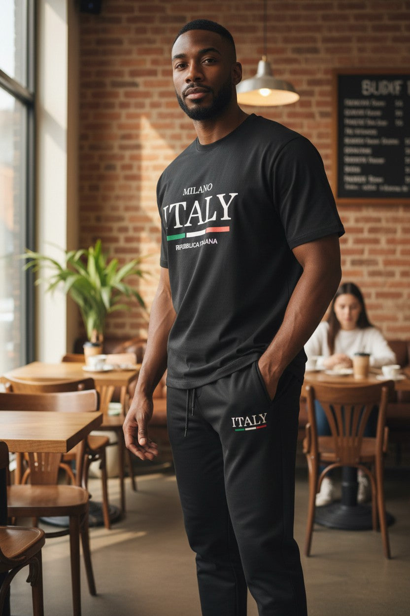 Man wearing a black Milano Italy t-shirt in a casual setting. Antler, Monza Outlet, Monza Fashion, Shein Outlet