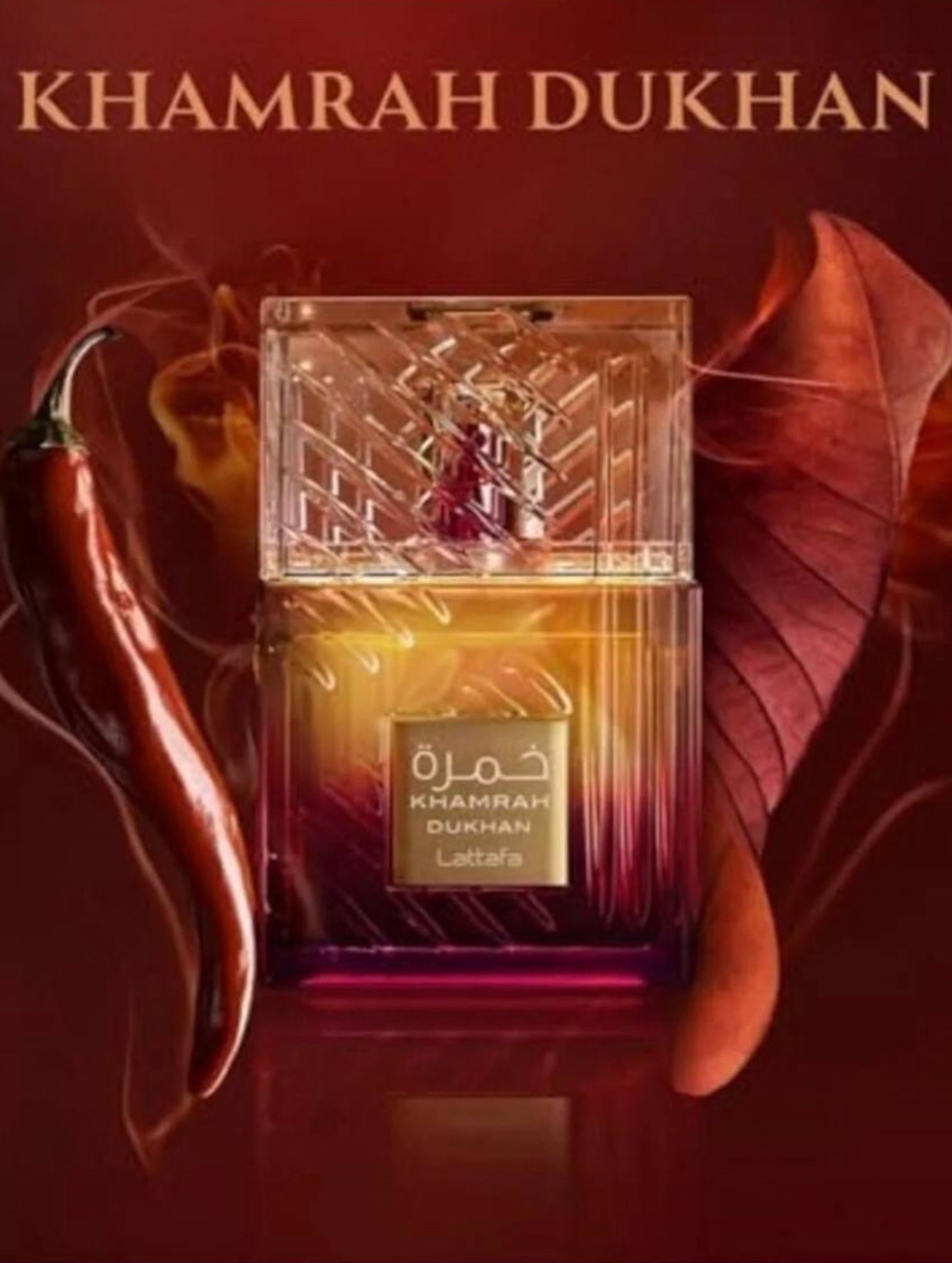 Khamrah Dukhan perfume bottle with a red leaf and pepper on a dark background. Lattafa, Monza Outlet, Monza Fashion, Shein Outlet