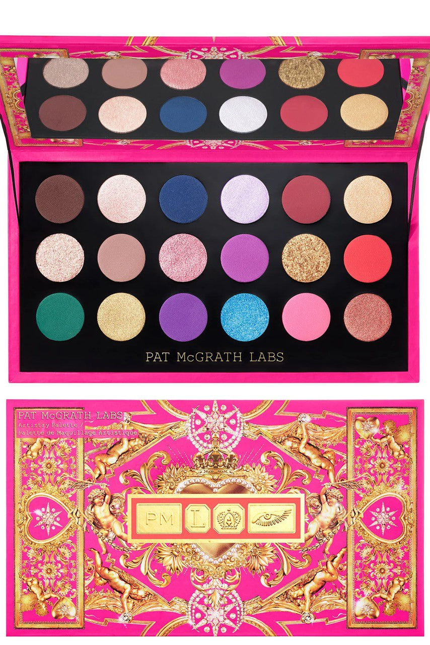 Eye shadow palette by Pat McGrath Labs with various shades displayed in a fan-like arrangement, encased in a pink box with gold decorative elements. Monza Outlet
