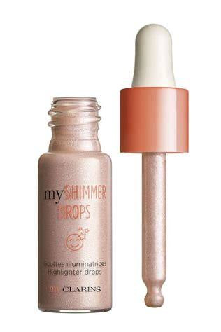 Clarins myShimmer Drops highlighter bottle with applicator on a white background 