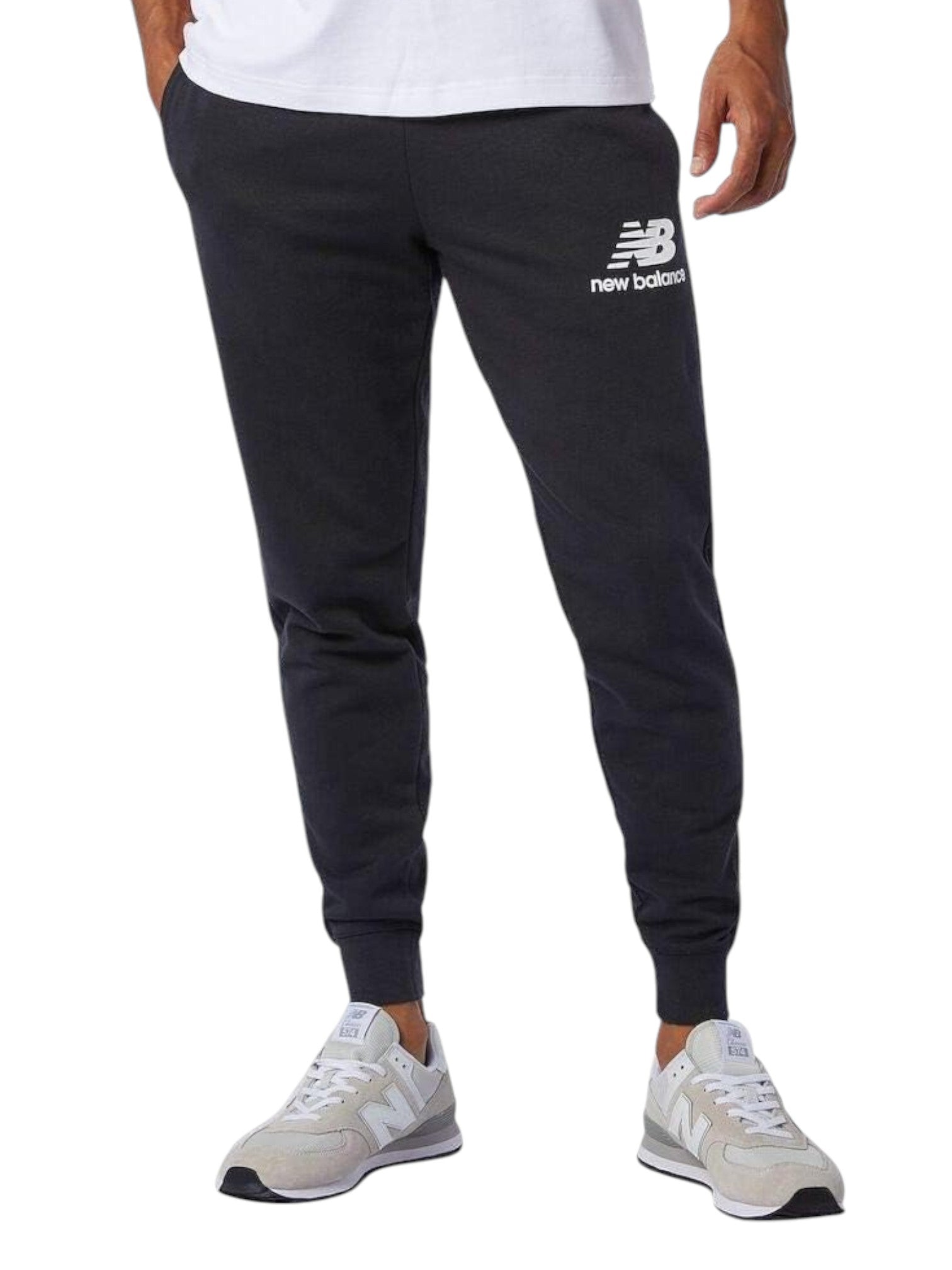 Person wearing black New Balance sweatpants on a white background. New Balance, Monza Outlet, Monza Fashion, Shein Outlet
