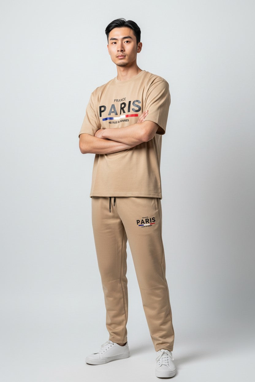 Man wearing a beige Paris t-shirt and pants on a white background. Antler, Monza Outlet, Monza Fashion, Shein Outlet