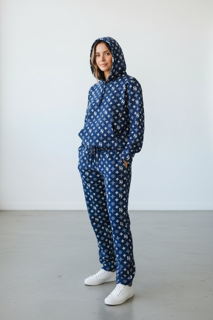 Person wearing a blue patterned hoodie and pants set on a white background. Antler, Monza Outlet, Monza Fashion, Shein Outlet