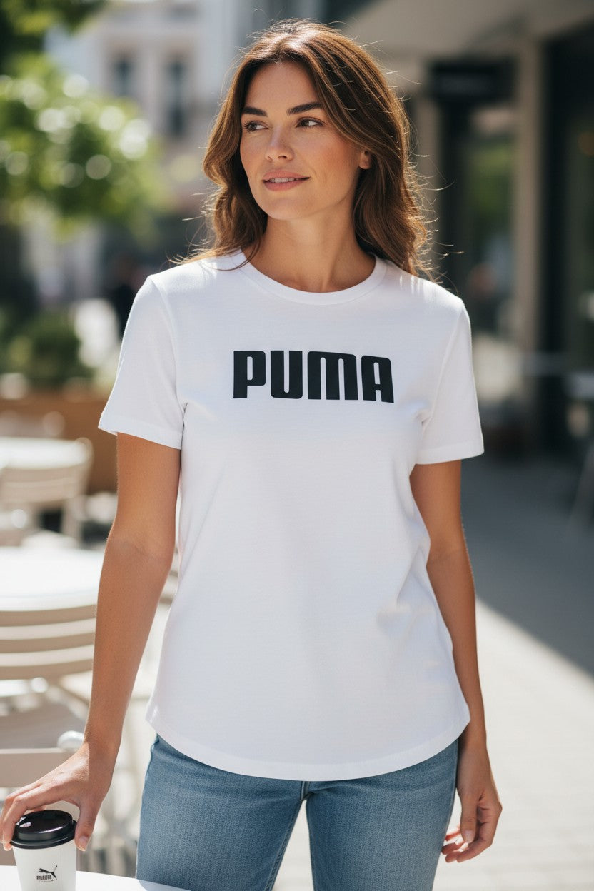 Woman wearing a white Puma t-shirt outdoors. Puma, Monza Outlet, Monza Fashion, Shein Outlet 
