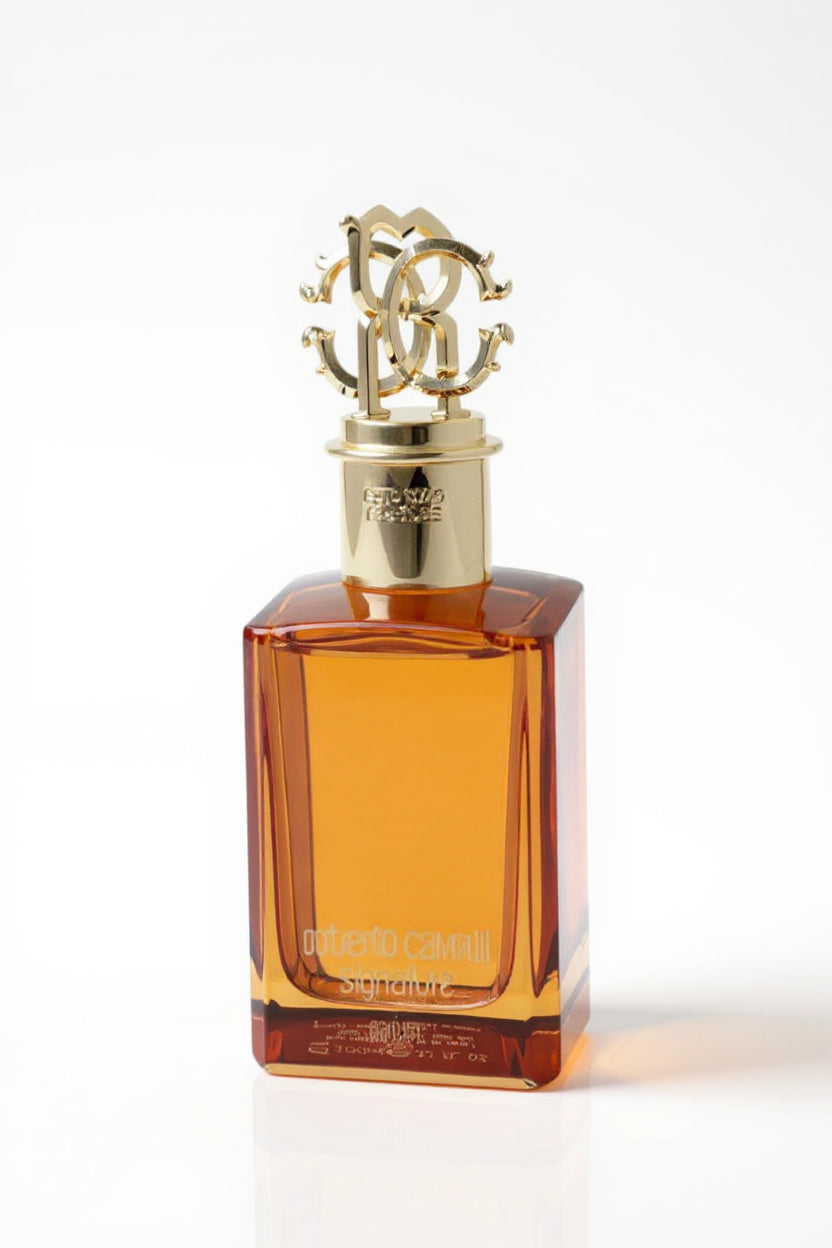 Perfume bottle with gold cap on a white background. Roberto Cavalli, Monza Outlet, Monza Fashion, Shein Outlet