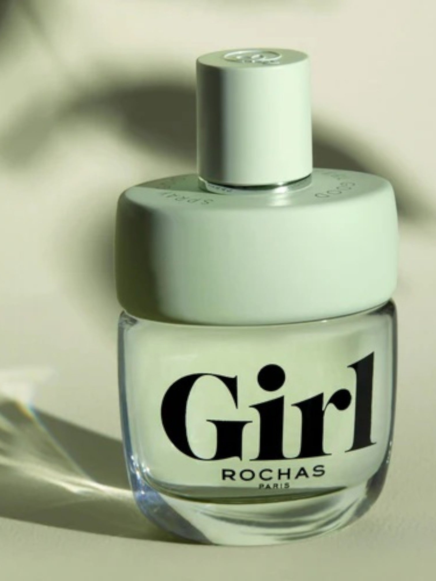 Perfume bottle labeled Girl Rochas on a neutral background. Rochas, Monza Outlet, Monza Fashion, Shein Outlet