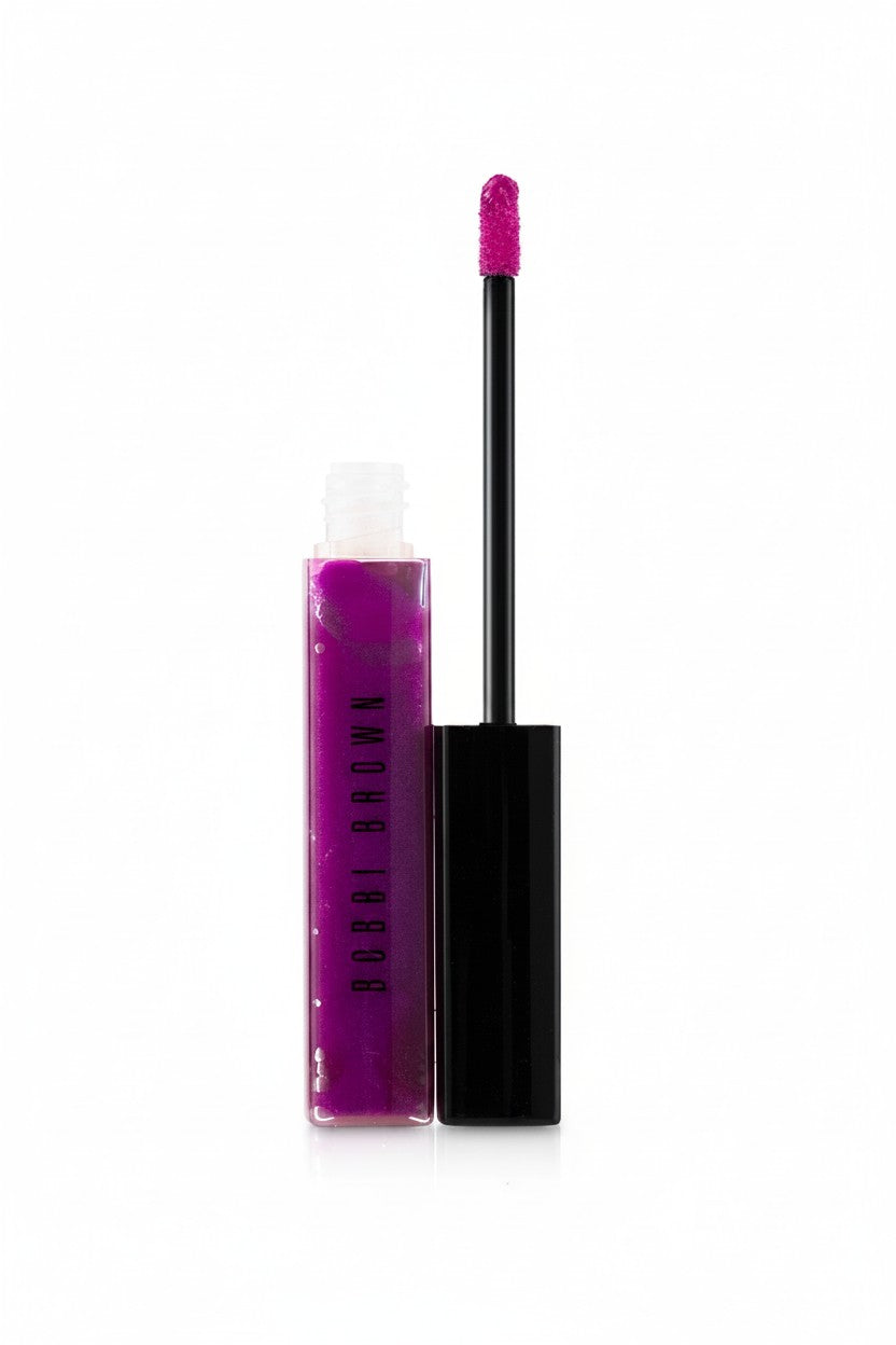 Bob Brown Amor Lipos liquid lip color in a vibrant magenta pink shade, shown with the clear tube, black cap, and applicator wand on a white background. Bobbi Brown, Monza Outlet, Monza Fashion, Shein Outlet