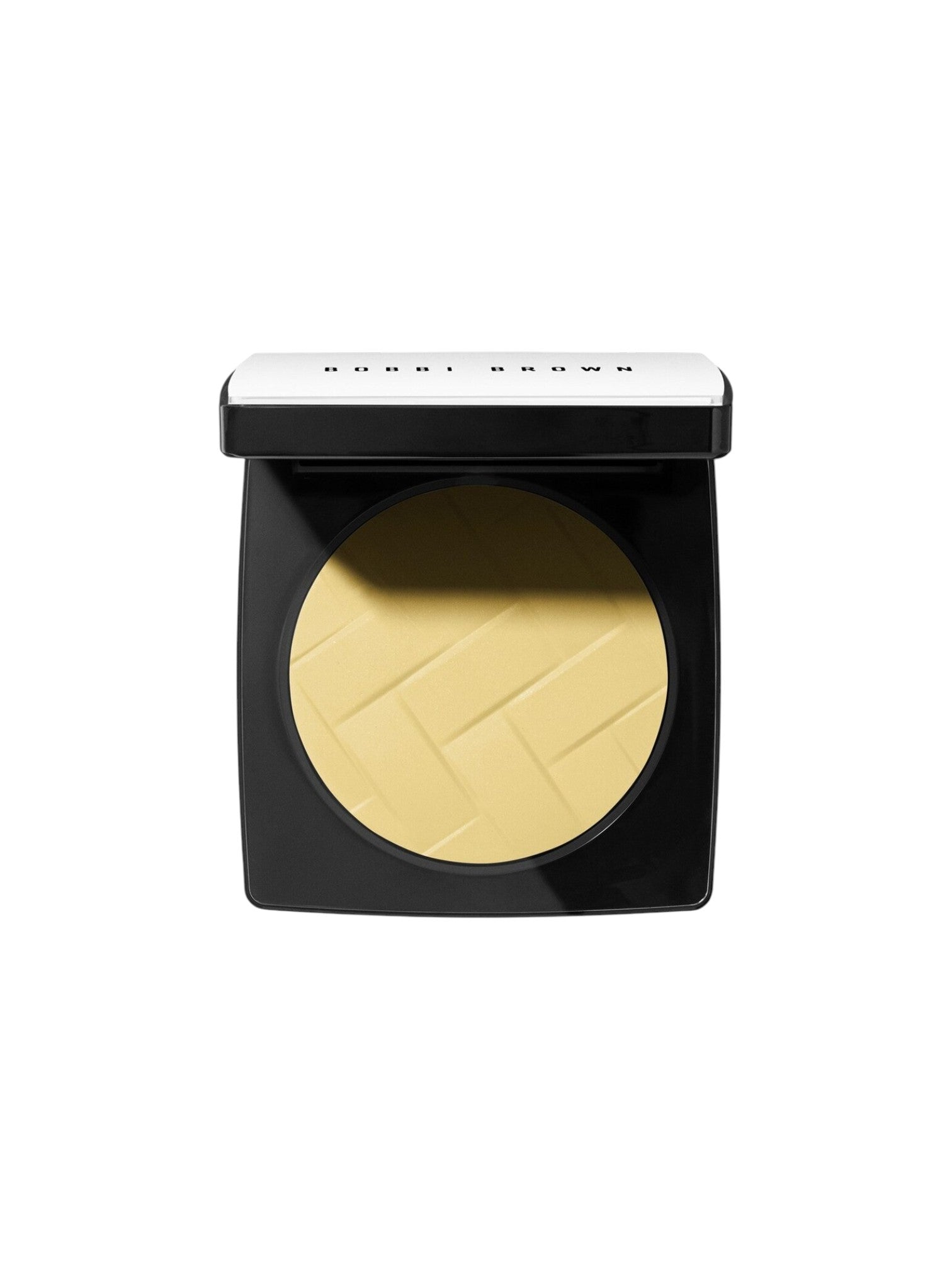 Bobbi Brown powder compact with yellow powder on a white background. Bobbi Brown, Monza Outlet, Monza Fashion, Shein Outlet