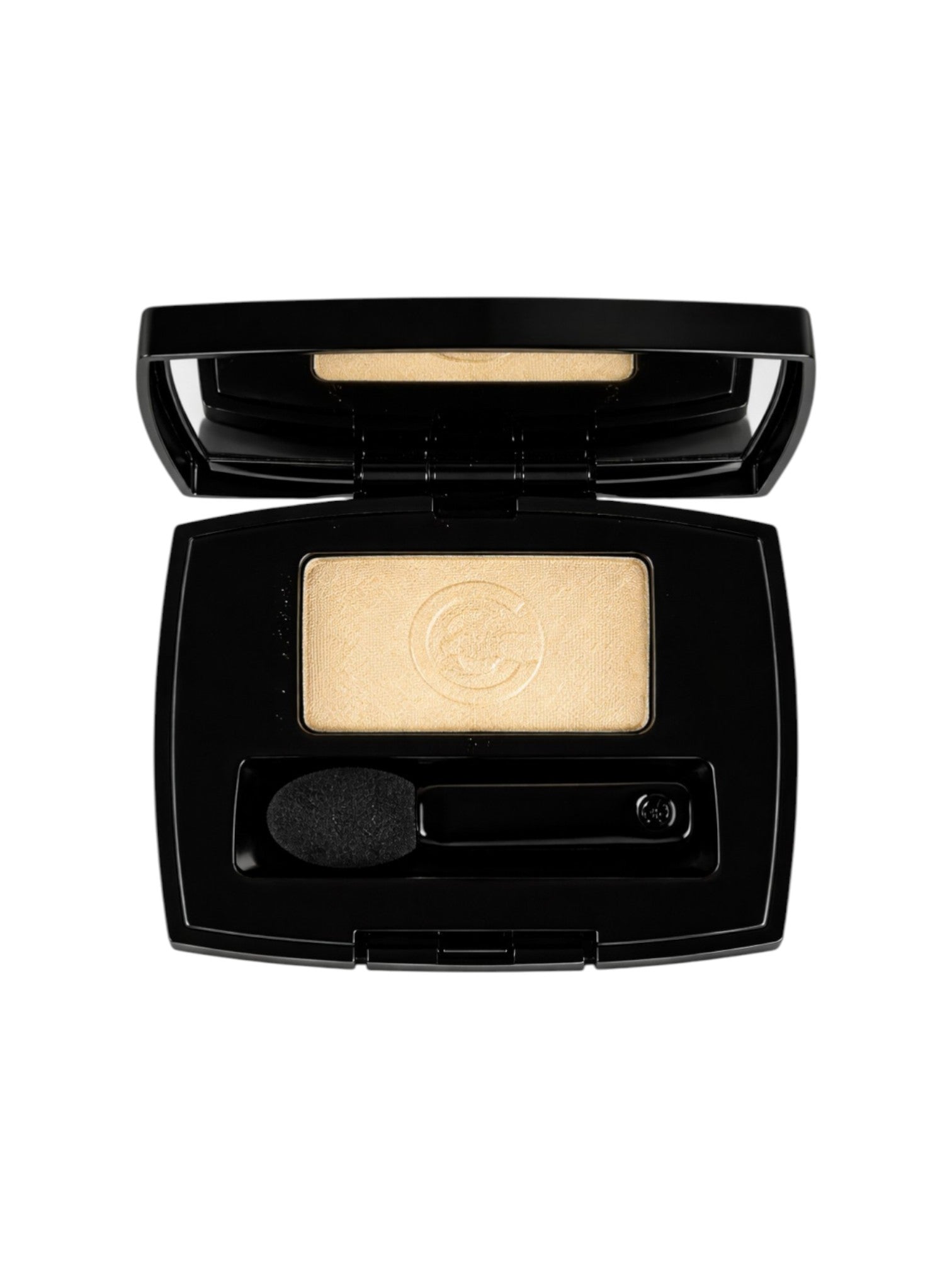 Makeup compact with beige powder and applicator on a white background. Chanel, Monza Outlet, Monza Fashion, Shein Outlet 