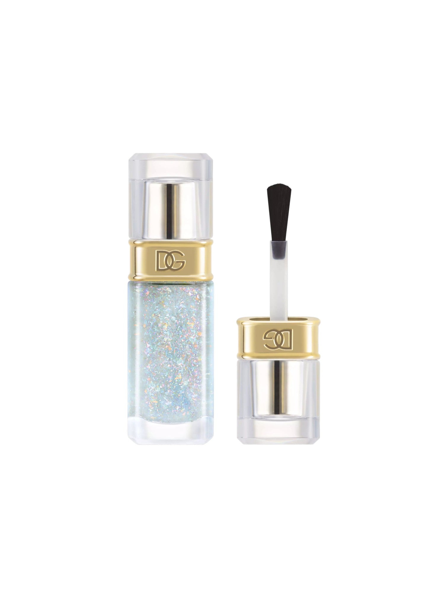 A clear cosmetic bottle filled with iridescent holographic glitter polish, shown next to its cap with a clear applicator brush. The bottle and cap feature a shiny gold band with a silver monogram logo. Dolce and Gabanna, Monza Outlet, Monza Fashion, Shein Outlet