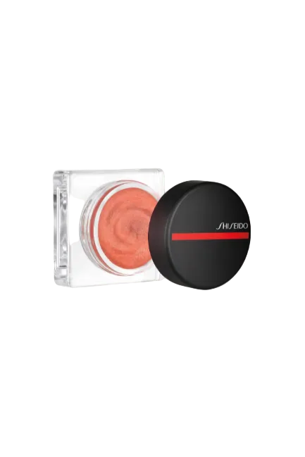 Shiseido makeup product with open lid showing orange color on a white background Monza Outlet