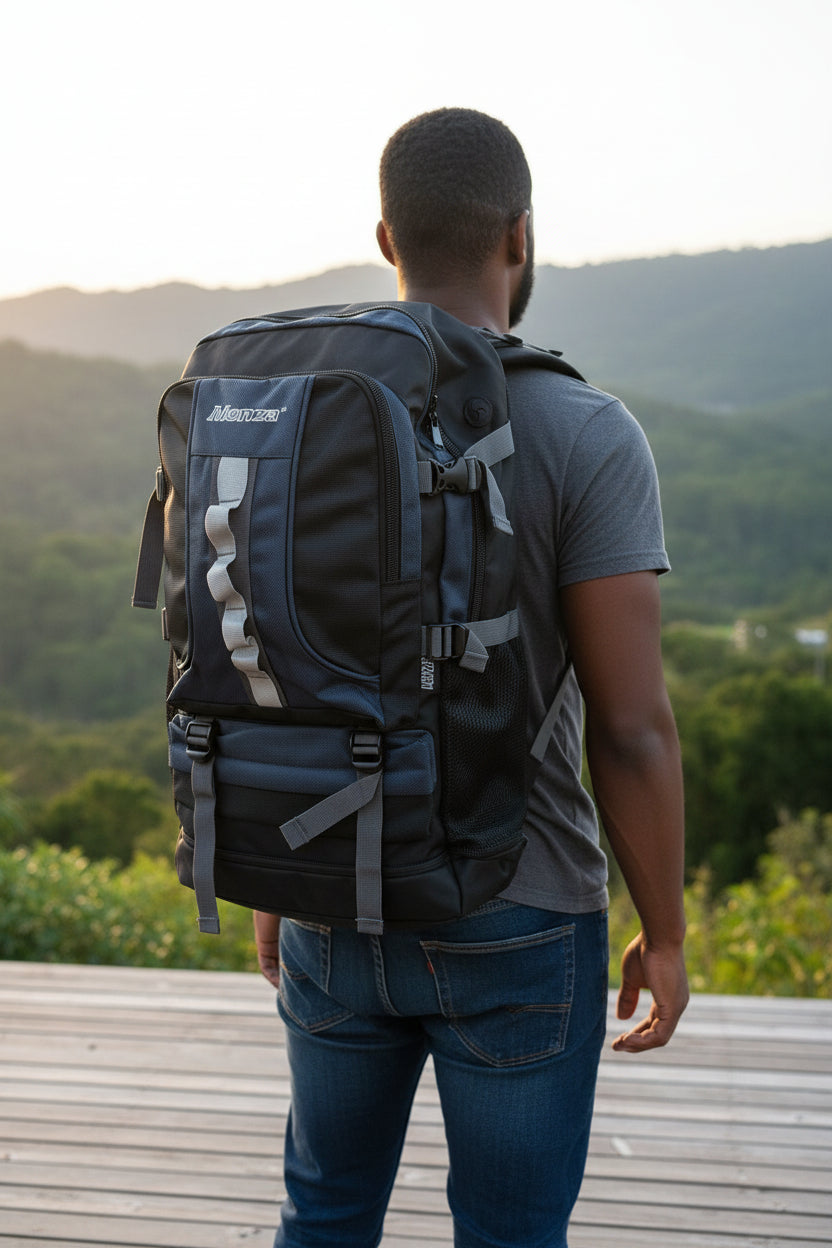 Person wearing a black backpack with a scenic mountain background. Monza Italy, Monza Outlet, Monza Fashion, Shein Outlet