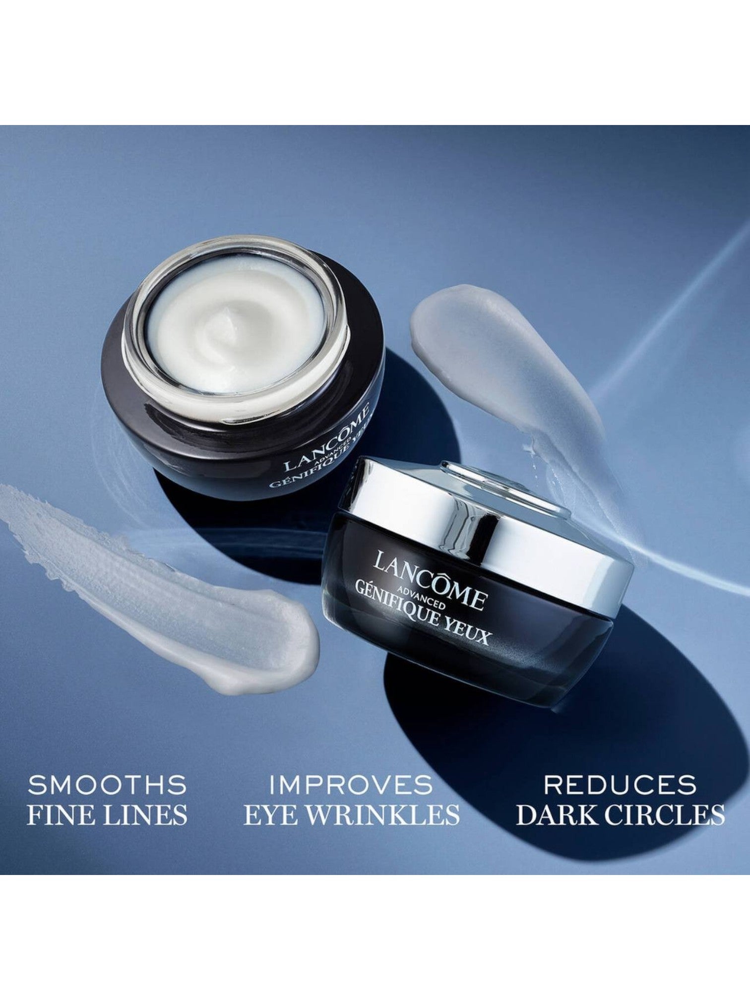 Lancème eye cream jars with product application on a blue background. Lancome, Monza Outlet, Monza Fashion, Shein Outlet 