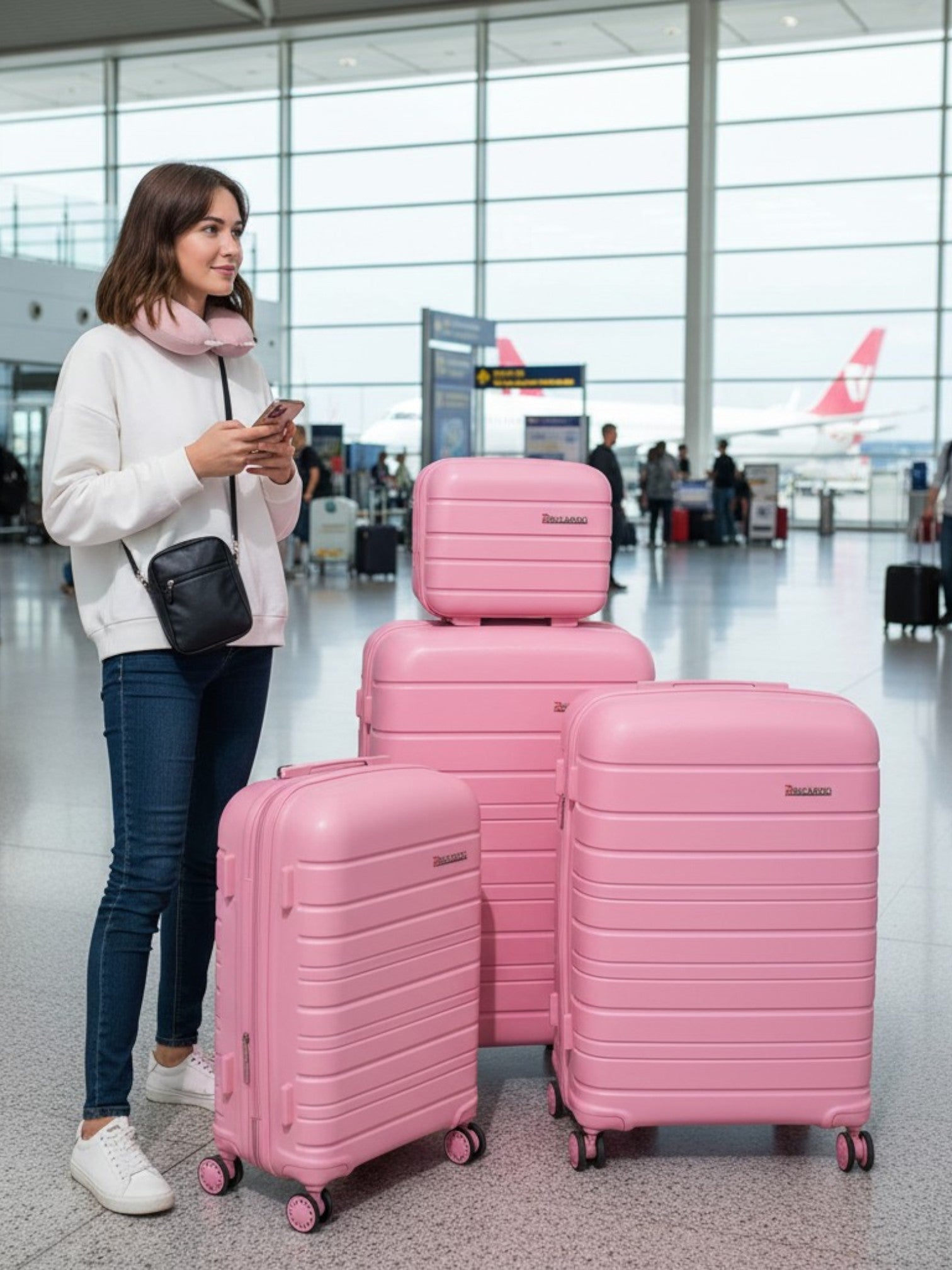 Woman standing with pink luggage at an airport Ricardo Monza Outlet, Monza Fashion, Shein Outlet
