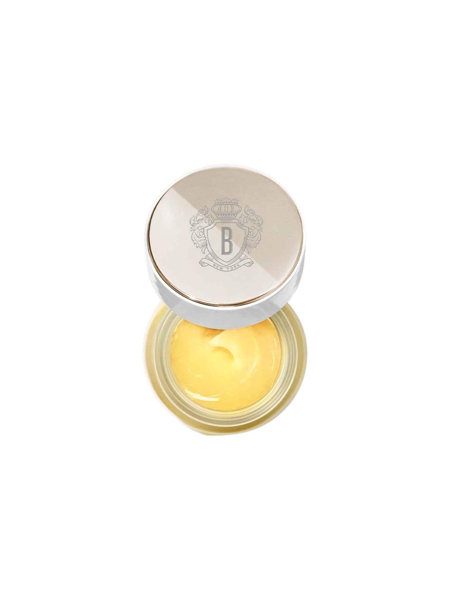 Cosmetic cream in a round container with a silver lid on a white background. Bobbi Brown, Monza Outlet, Monza Fashion, Shein Outlet
