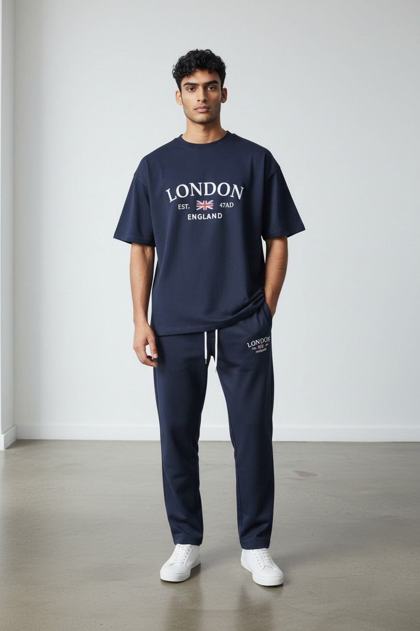 Man wearing a navy London England t-shirt and pants against a white background. Antler, Monza Outlet, Monza Fashion, Shein Outlet