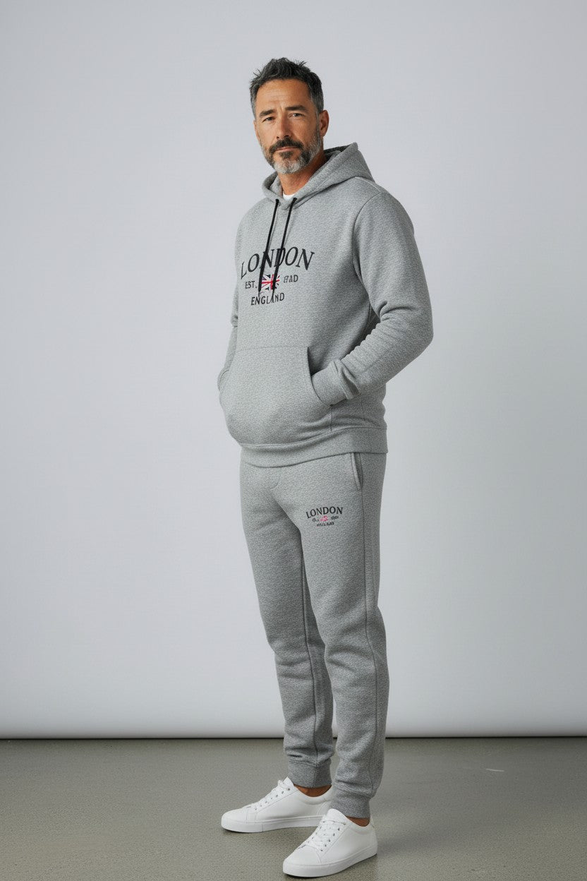 Man wearing a gray London tracksuit against a white background. Antler, Monza Outlet, Monza Fashion, Shein Outlet