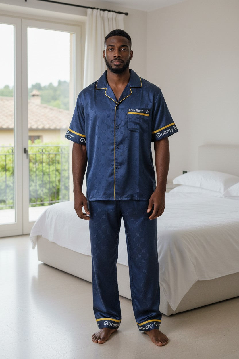 Man wearing blue satin pajamas in a bedroom. Monza Italy, Monza Outlet, Monza Fashion, Shein Outlet