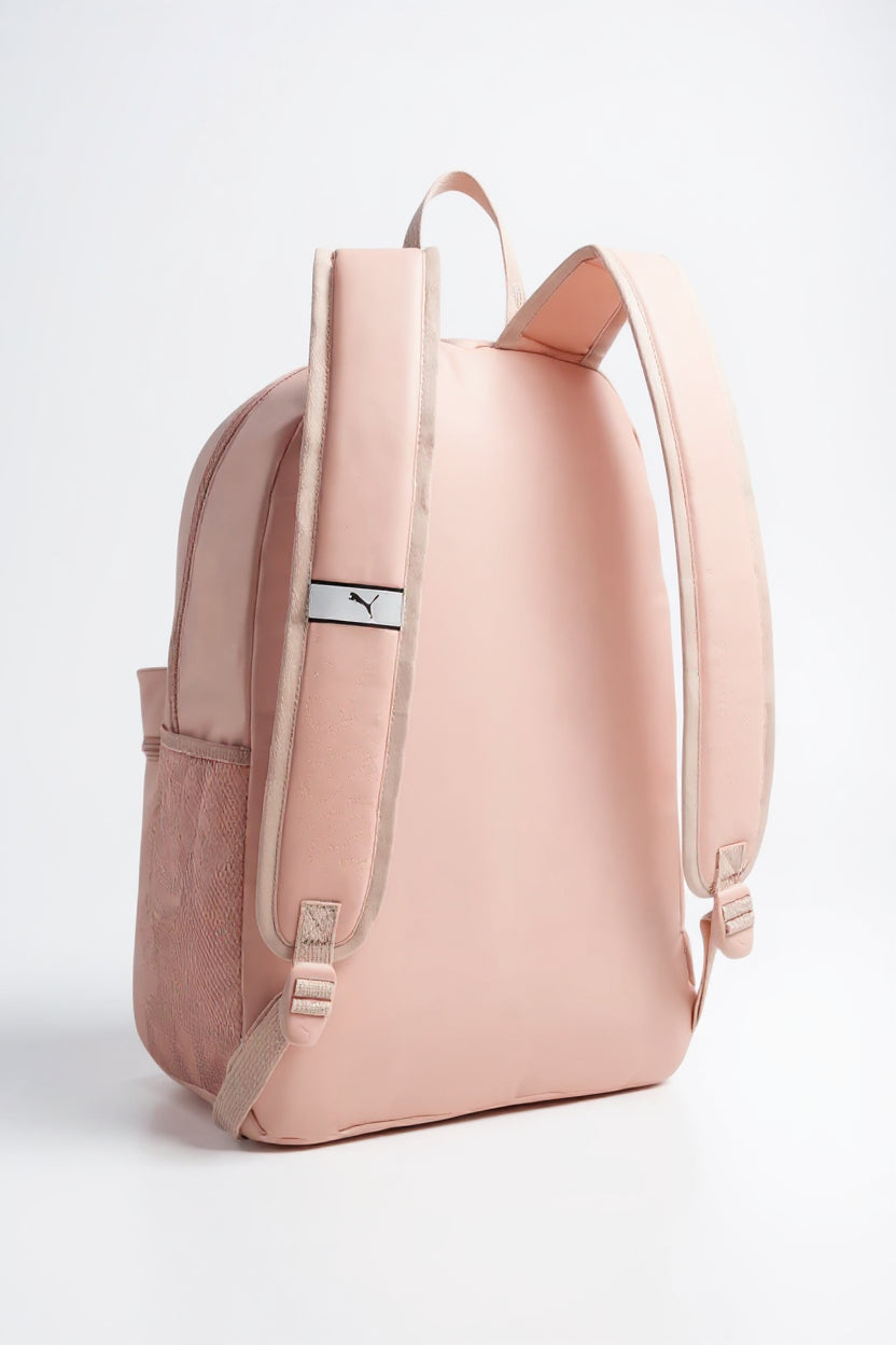 Pink backpack with a visible brand logo on a light gray background. Puma, Monza Outlet, Monza Fashion, Shein Outlet