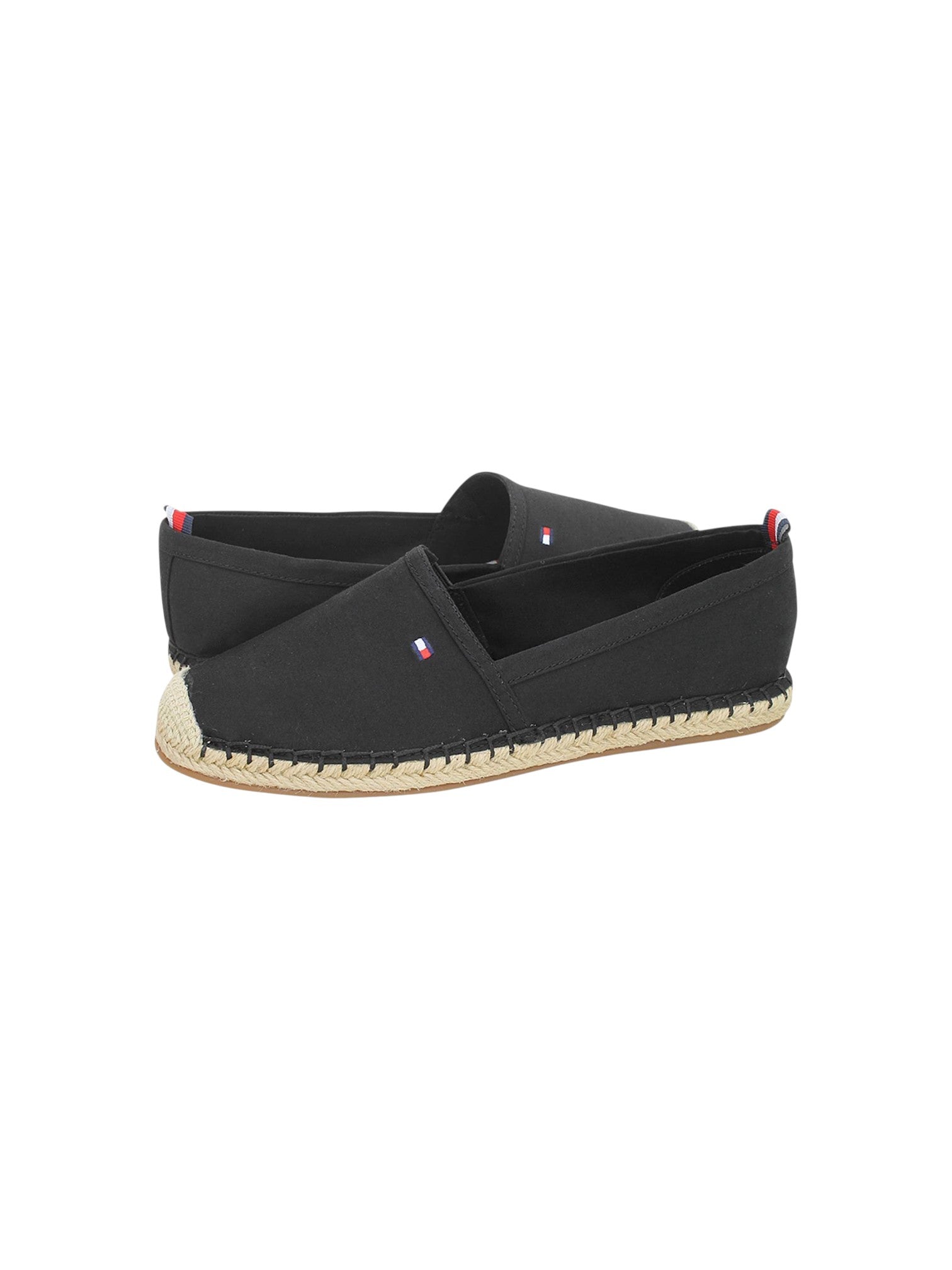 A pair of black canvas espadrille slip on shoes with natural jute wrapped soles and small red, white, and blue logo tabs on the heel and side, displayed against a plain white background. Tommy Hilfiger, Monza Outlet, Monza Fashion, Shein Outlet