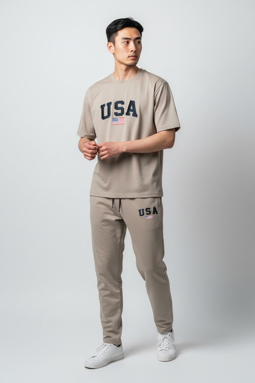 Man wearing a beige USA t-shirt and pants on a white background. Antler, Monza Outlet, Monza Fashion, Shein Outlet