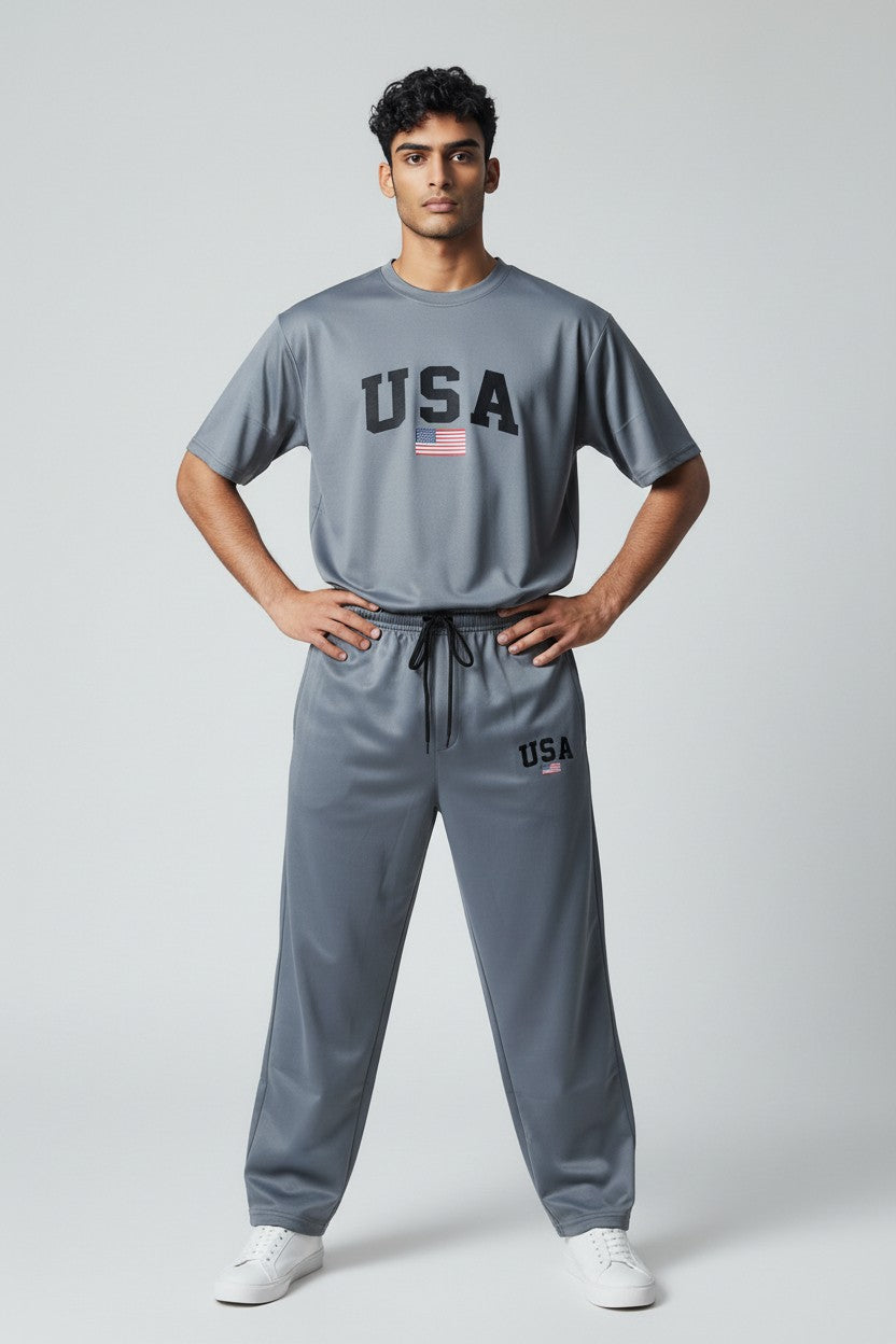 Man wearing a gray USA branded outfit on a white background. Antler, Monza Outlet, Monza Fashion, Shein Outlet