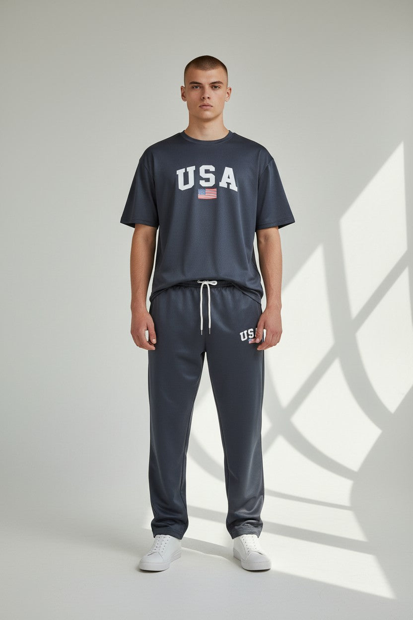 Man wearing a navy USA t-shirt and pants on a light gray background. Antler, Monza Outlet, Monza Fashion, Shein Outlet