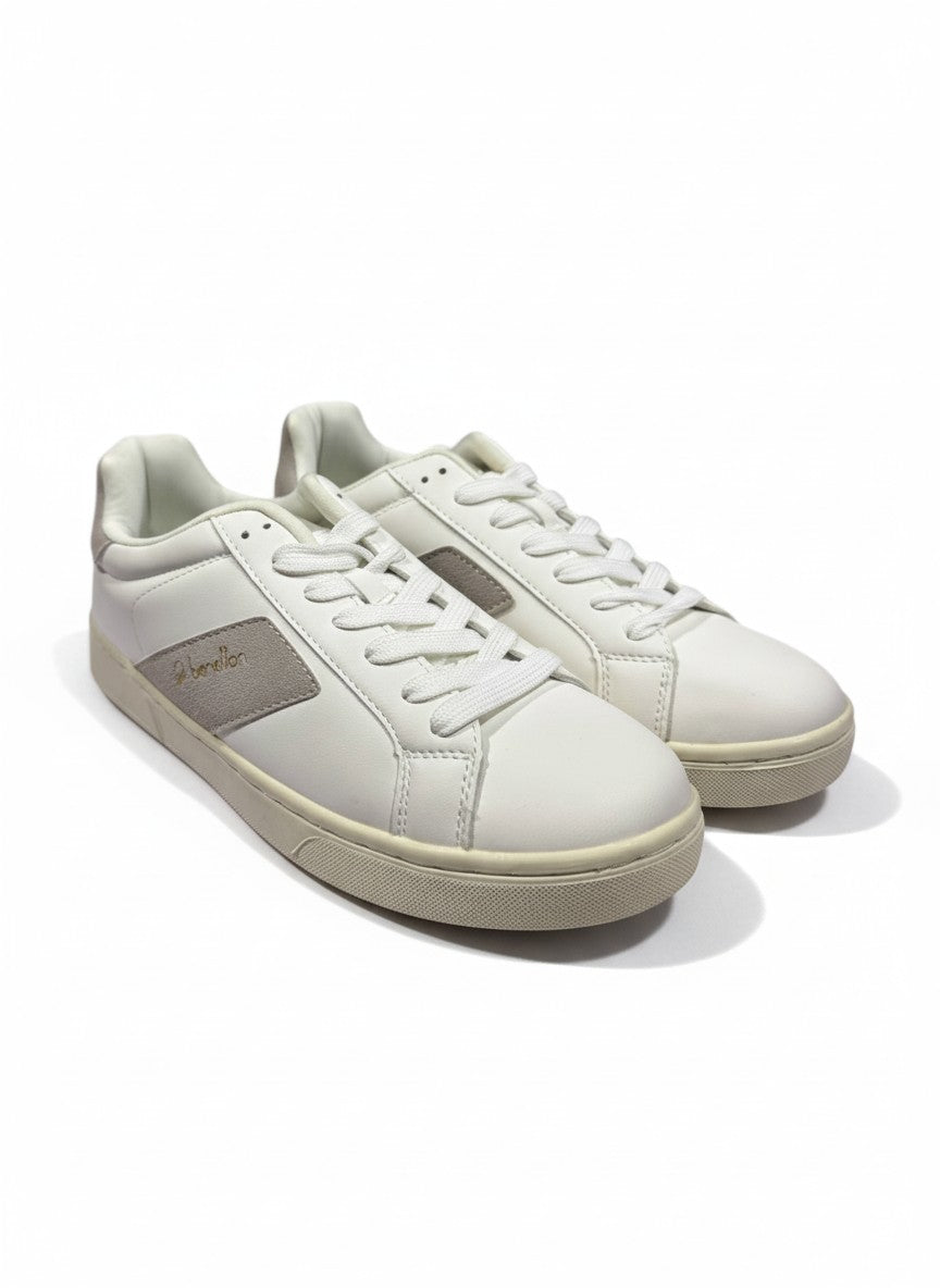 Pair of white sneakers on a white background.  United Colors of Benetton, Monza Outlet, Monza Fashion, Shein Outlet 