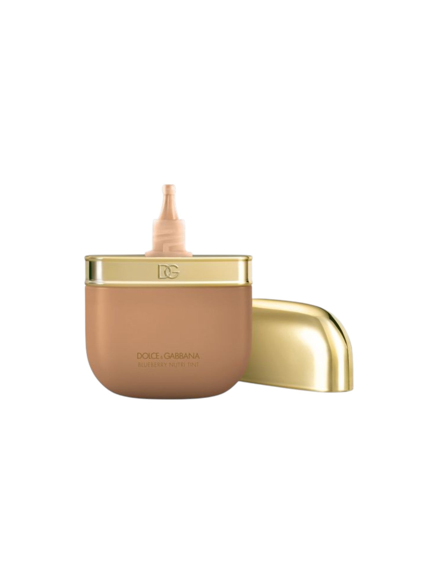 Dior Paris foundation jar in a warm tan shade with a metallic gold cap and applicator tip, shown on a plain white background. Dolce & Gabbana, Monza Outlet, Monza Fashion, Shein Outlet