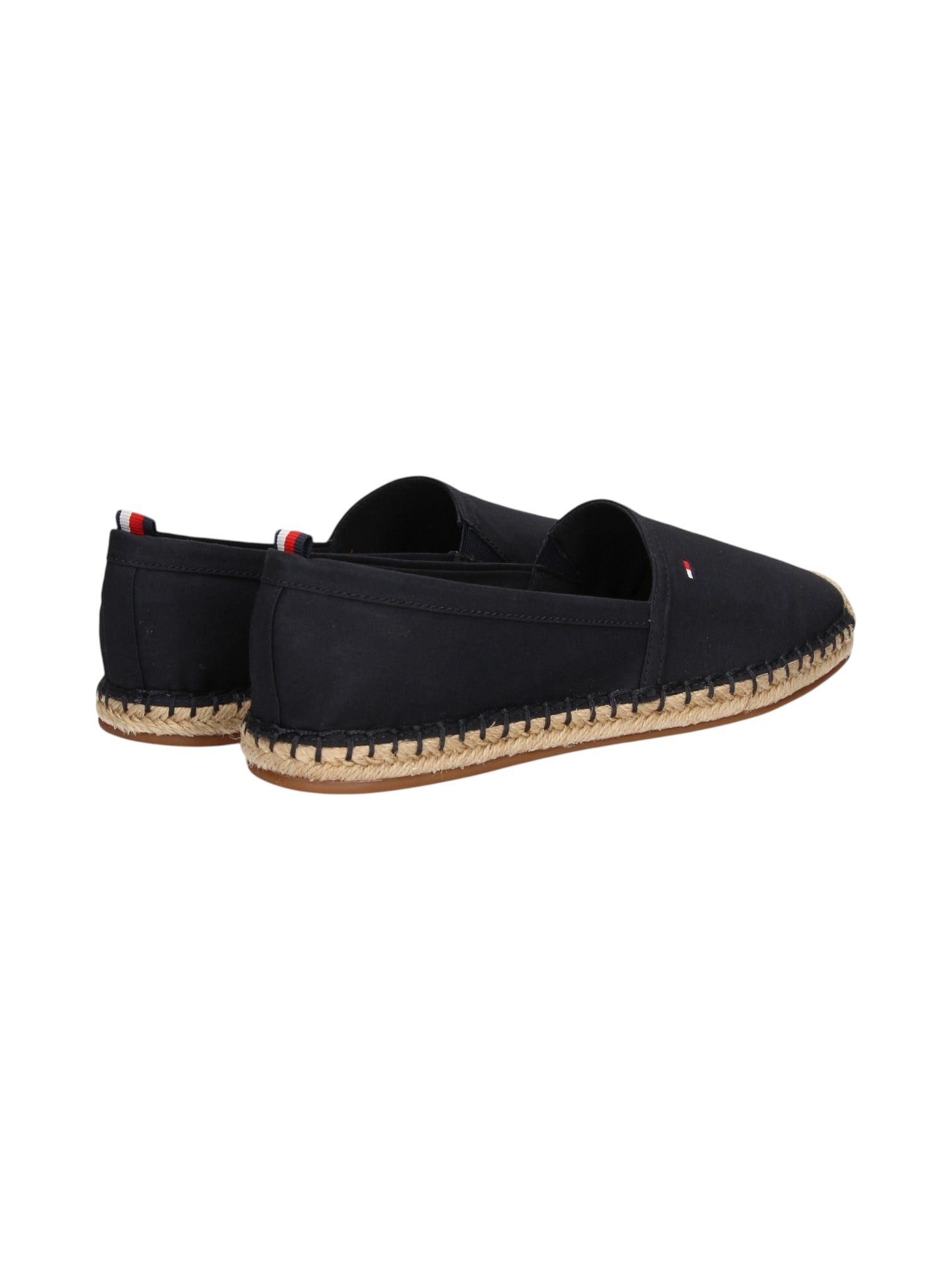 A pair of black espadrille slip on shoes with natural jute wrapped soles, shown from a three quarters angle on a white background. Tommy Hilfiger, Monza Outlet, Monza Fashion, Shein Outlet
