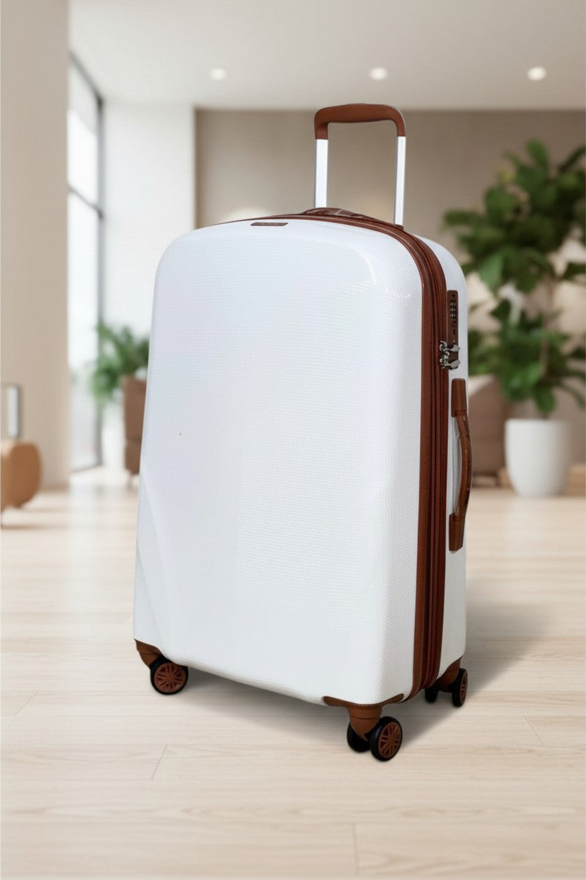 White suitcase with brown accents on a wooden floor. Monza Outlet, Monza Fashion, Shein Outlet