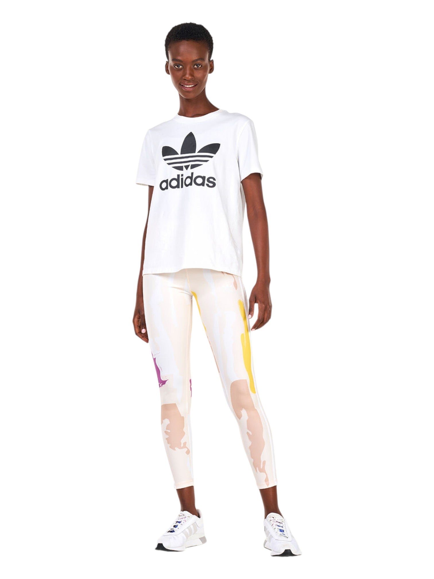 Person wearing an Adidas white t-shirt and colorful leggings on a white background. Adidas, Monza Outlet, Monza Fashion, Shein Outlet