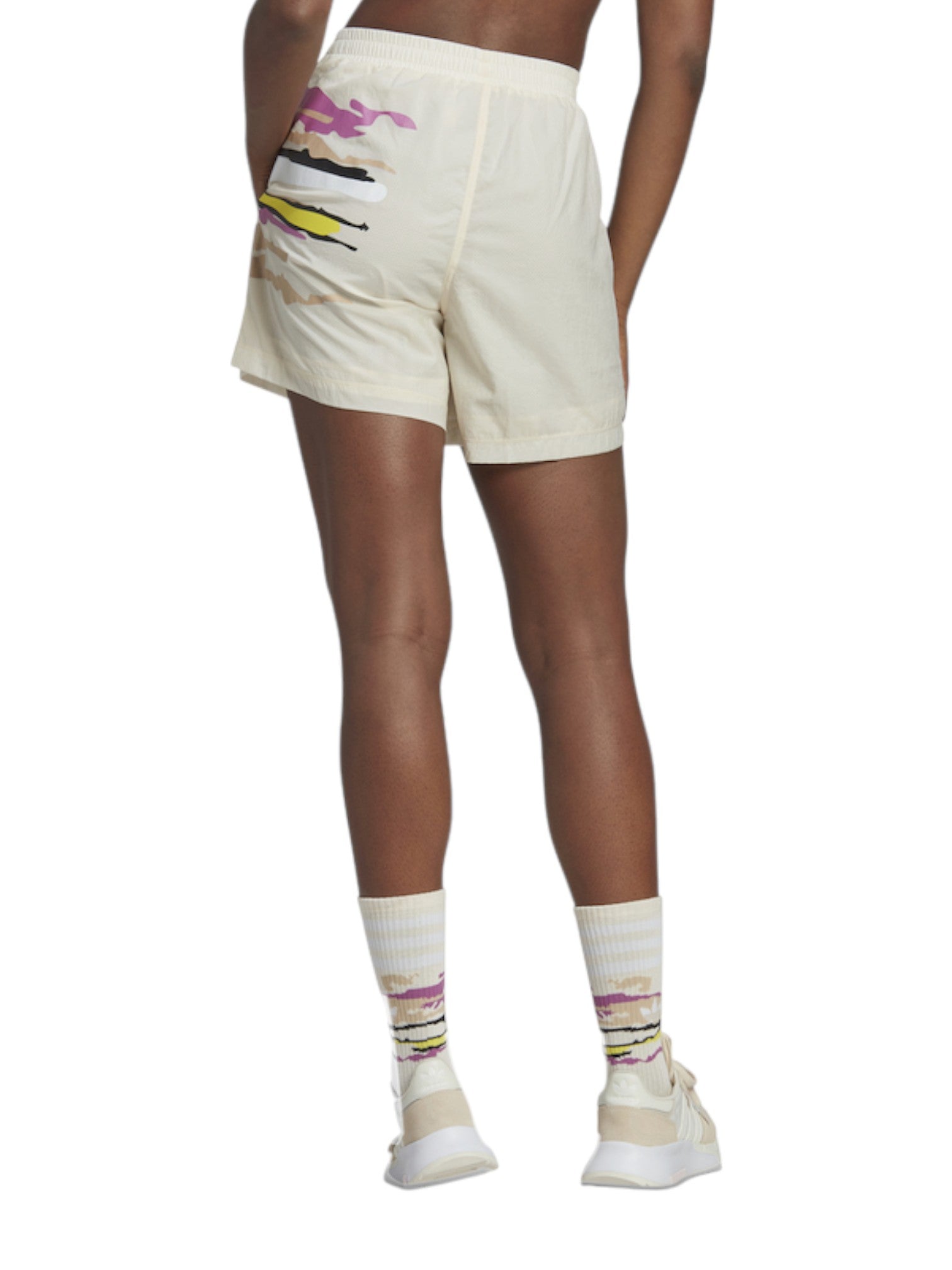 Person wearing cream shorts with colorful design and matching socks on a white background. Adidas, Monza Outlet, Monza Fashion, Shein Outlet