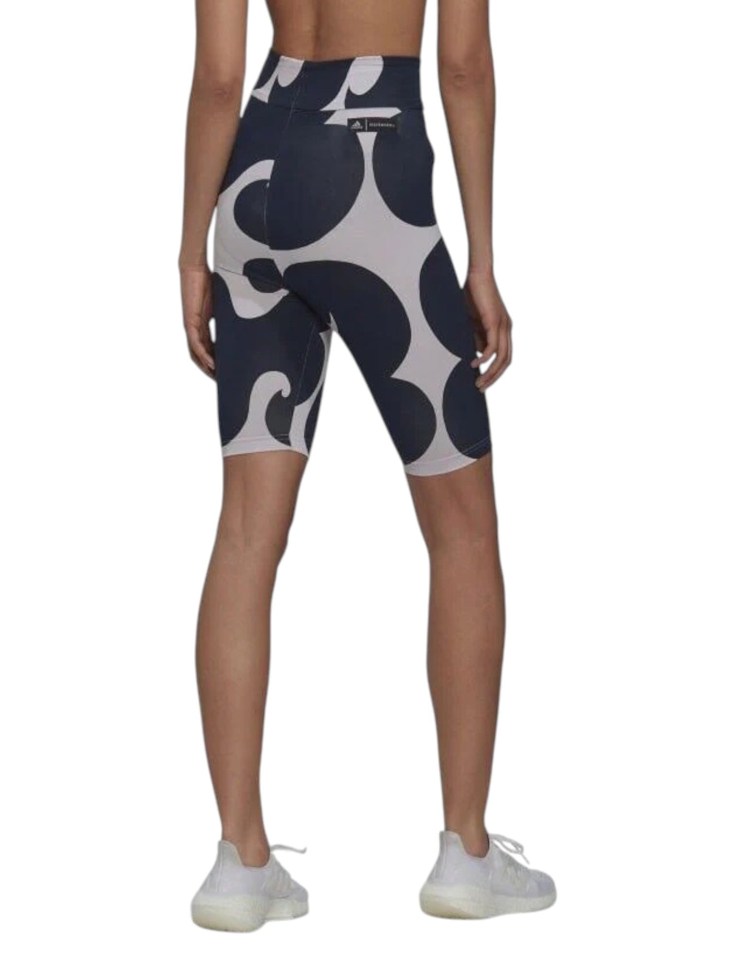 Person wearing navy and white patterned shorts on a white background. Adidas, Monza Outlet, Monza Fashion, Shein Outlet