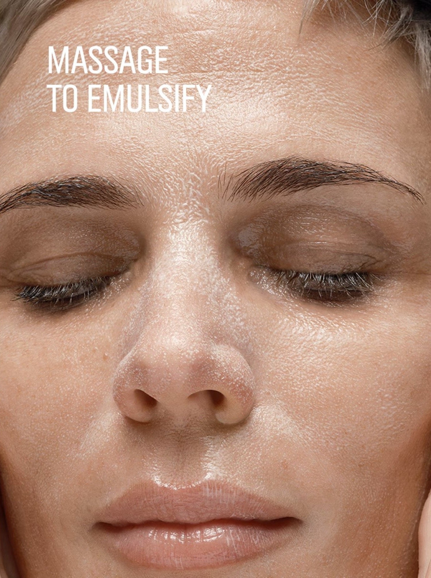 Close-up of a womans face with text Massage to Emulsify on a beige background. Bobbi Brown, Monza Outlet, Monza Fashion, Shein Outlet