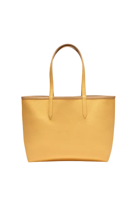 Yellow tote bag on a white background Lacoste Monza Outlet, Monza Fashion, Shein Outlet