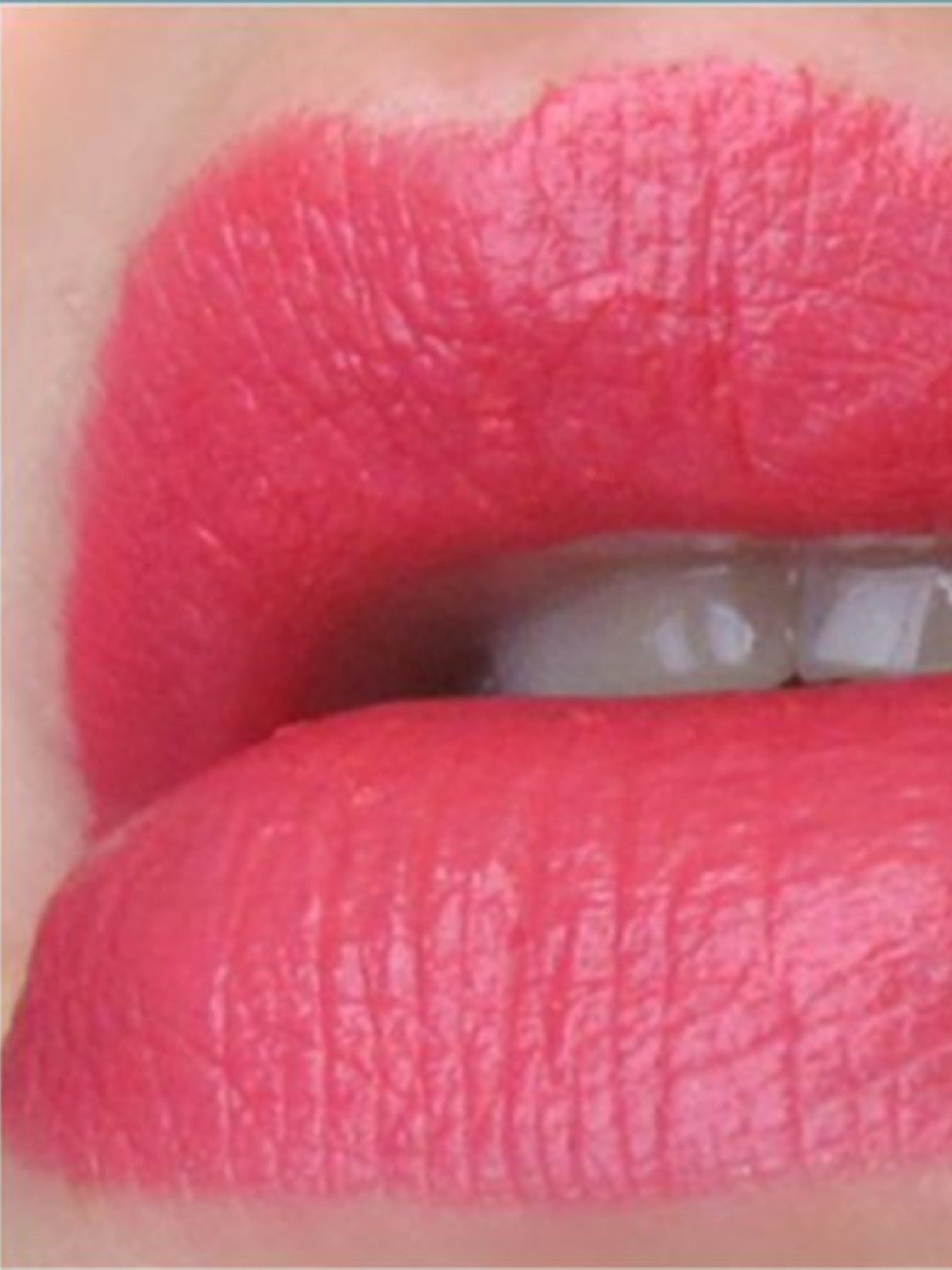 Closeup of lips wearing a vibrant pink lipstick with visible texture and a glossy finish. Dolce & Gabbana, Monza Outlet, Monza Fashion, Shein Outlet