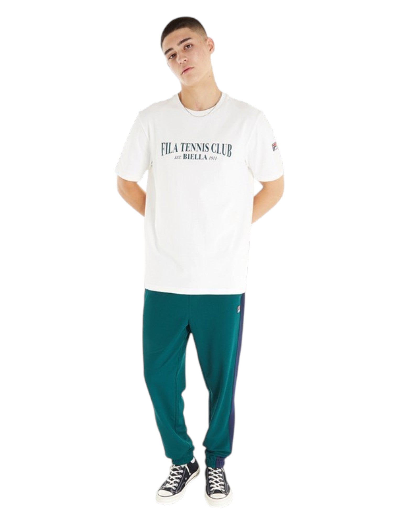 Person wearing a white t-shirt with text and teal pants on a white background. Fila, Monza Outlet, Monza Fashion, Shein Outlet