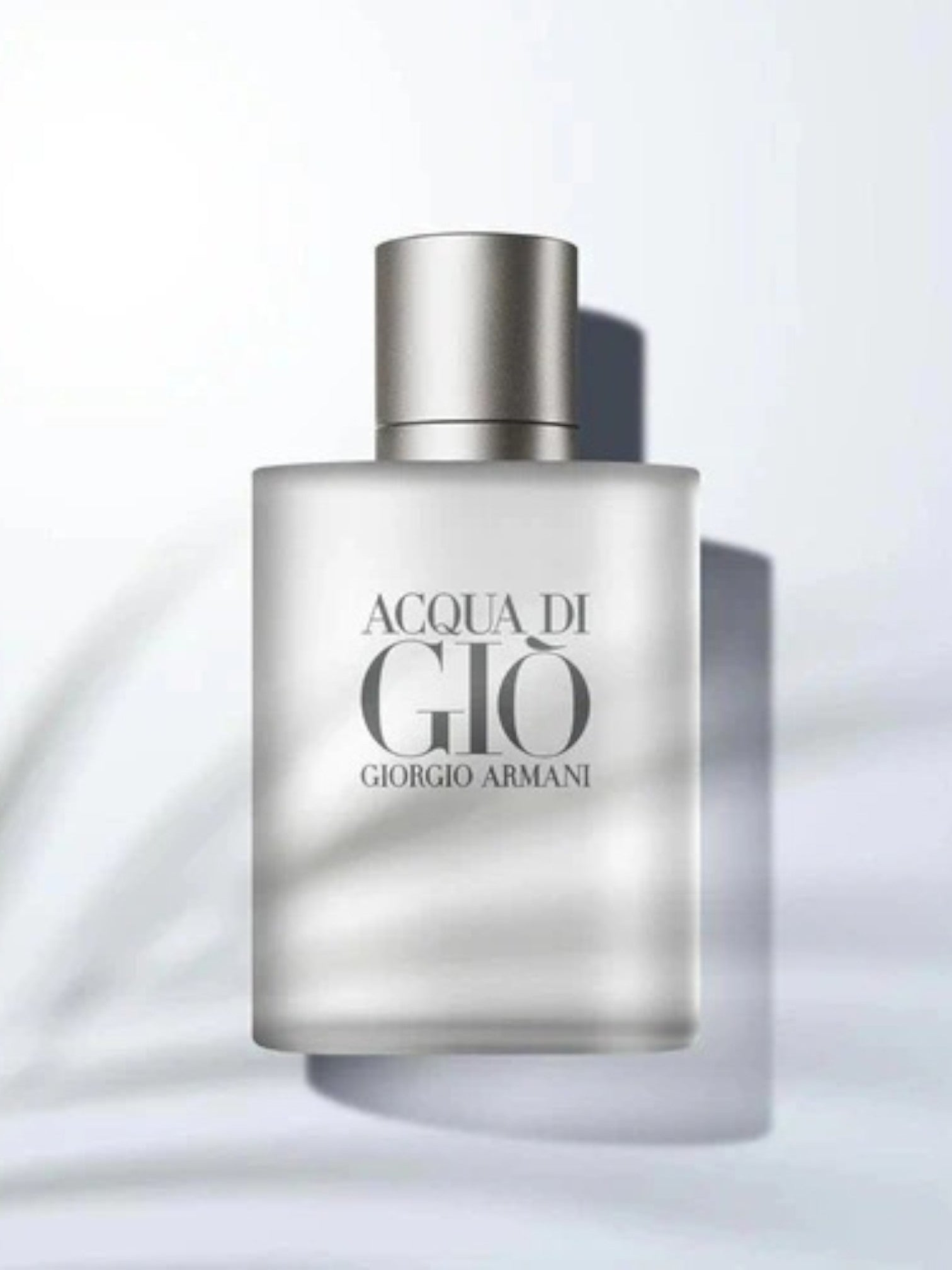Giorgio Armani Acqua di Giò perfume bottle on a light gray background. Giorgio Armani, Monza Outlet, Monza Fashion, Shein Outlet