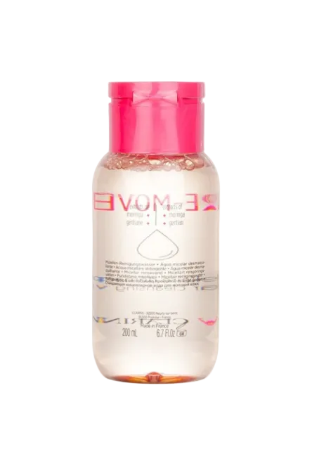 Skincare bottle with pink cap and white label on a white background. Clarins, Monza Outlet, Monza Fashion, Shein Outlet