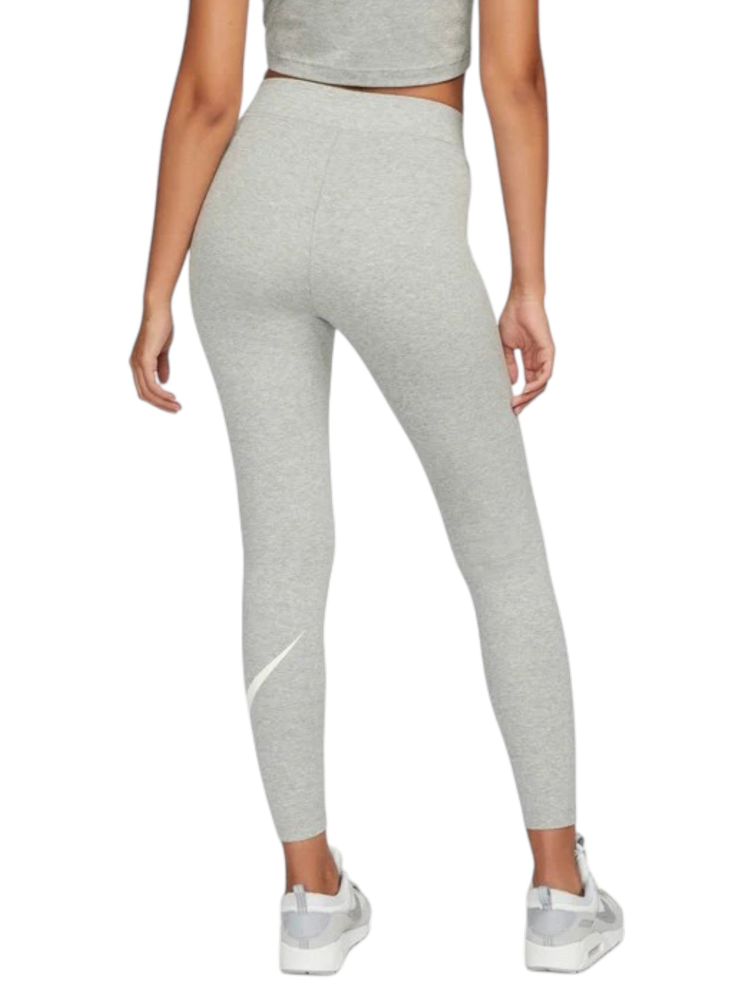 Person wearing gray leggings with a Nike logo on a white background. Nike, Monza Outlet, Monza Fashion, Shein Outlet