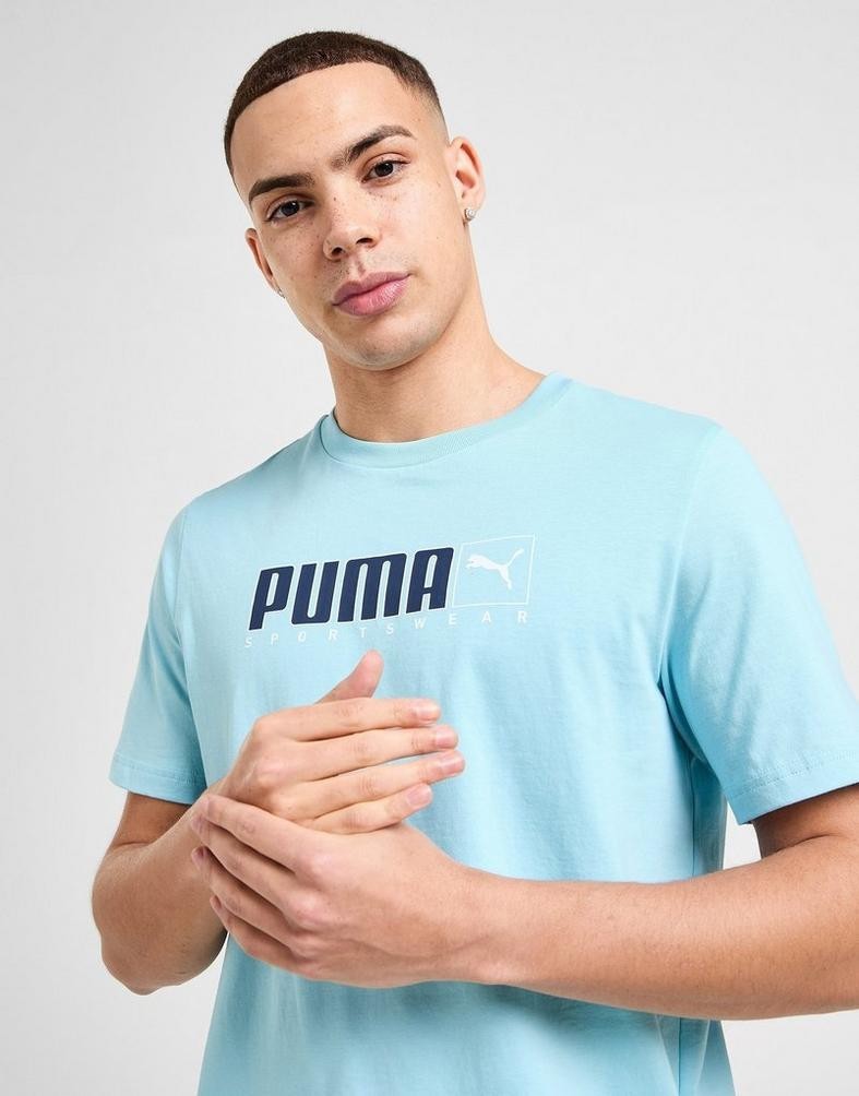 Man wearing a light blue Puma t-shirt against a plain background.  Puma, Monza Outlet, Monza Fashion, Shein Outlet 