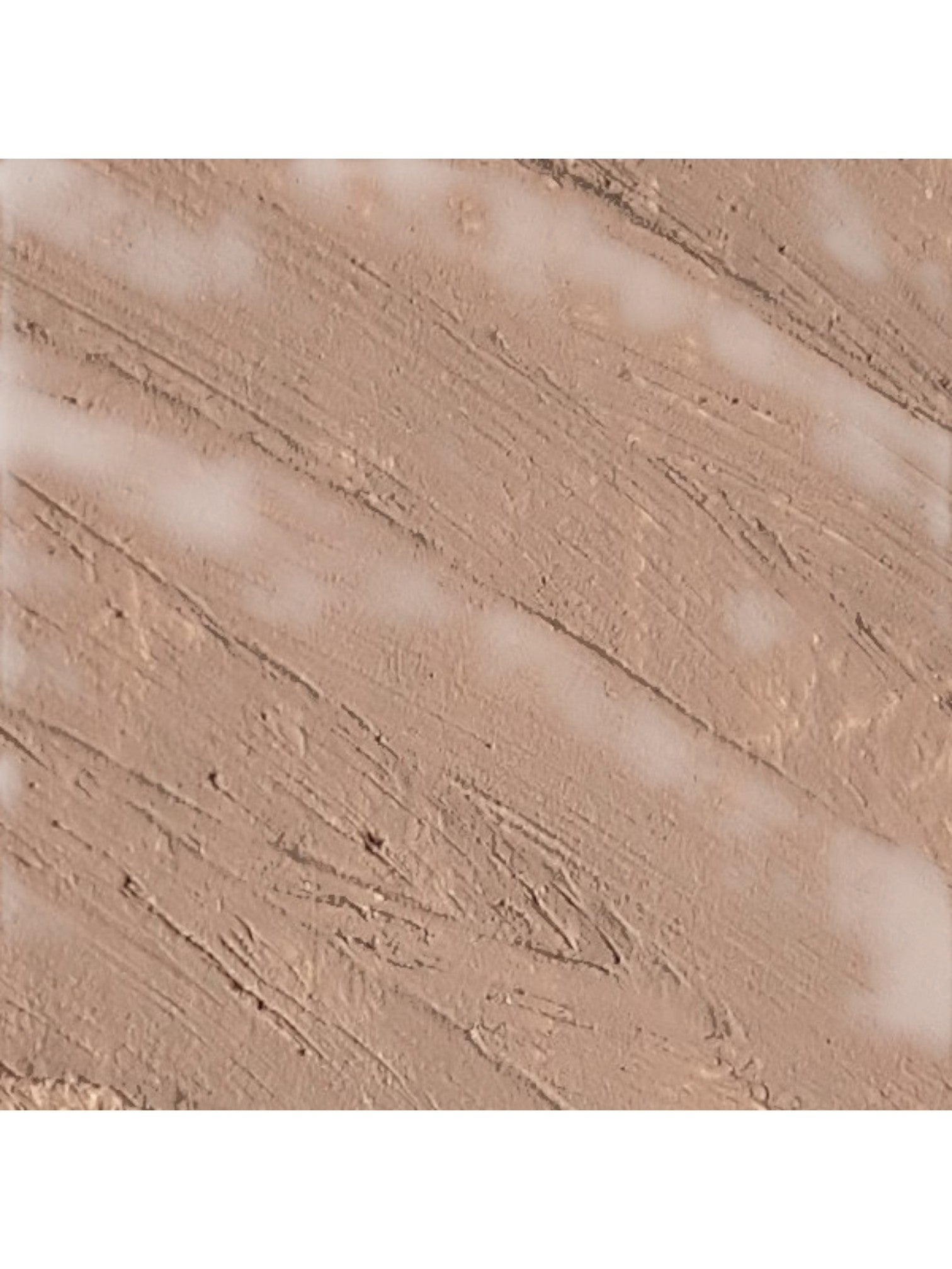 Close-up of beige makeup powder with texture and light reflections. Isadora, Monza Outlet, Monza Fashion, Shein Outlet 