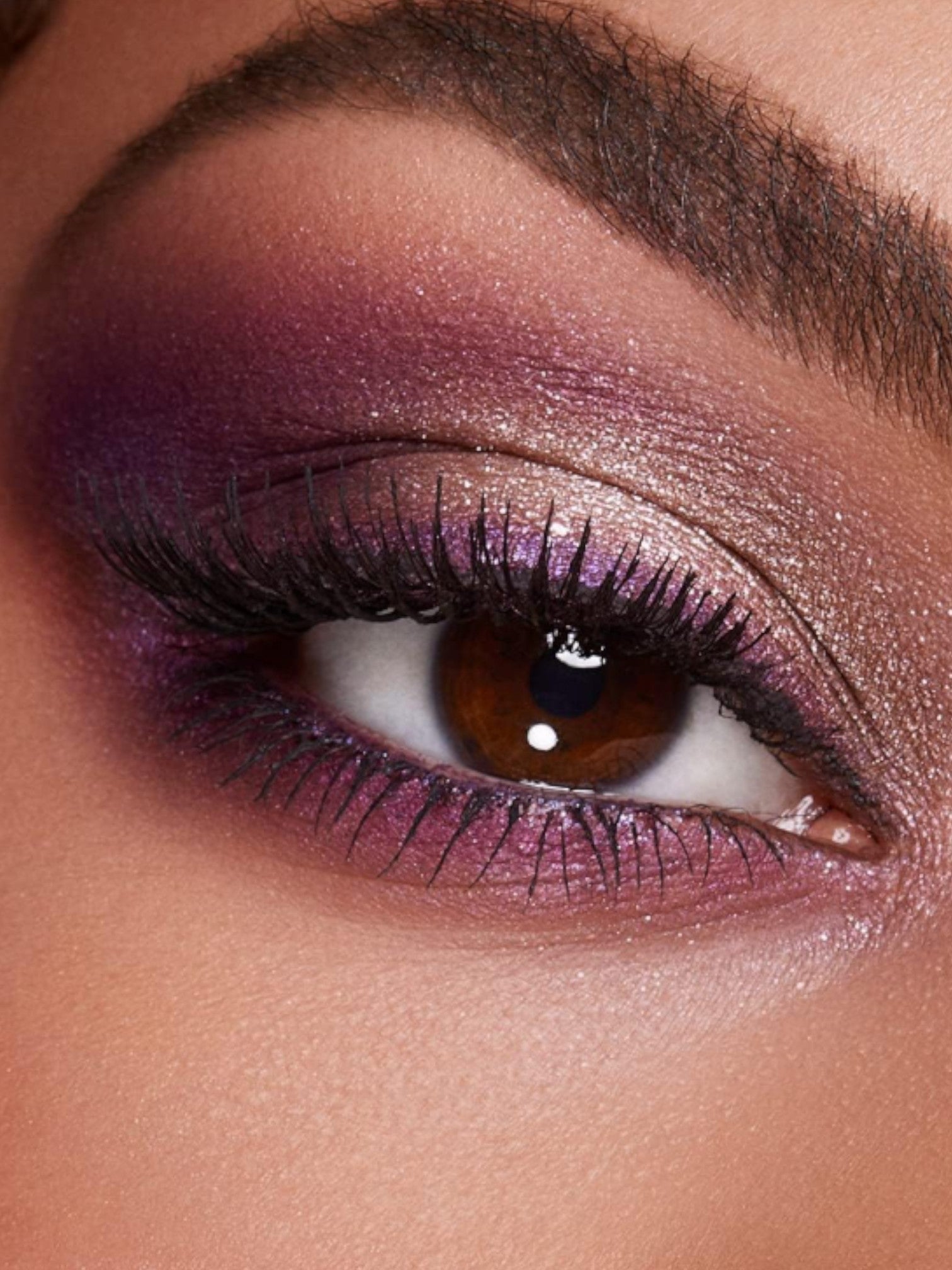 Close-up of an eye with purple and brown makeup. Kiko Milano, Monza Outlet, Monza Fashion, Shein Outlet