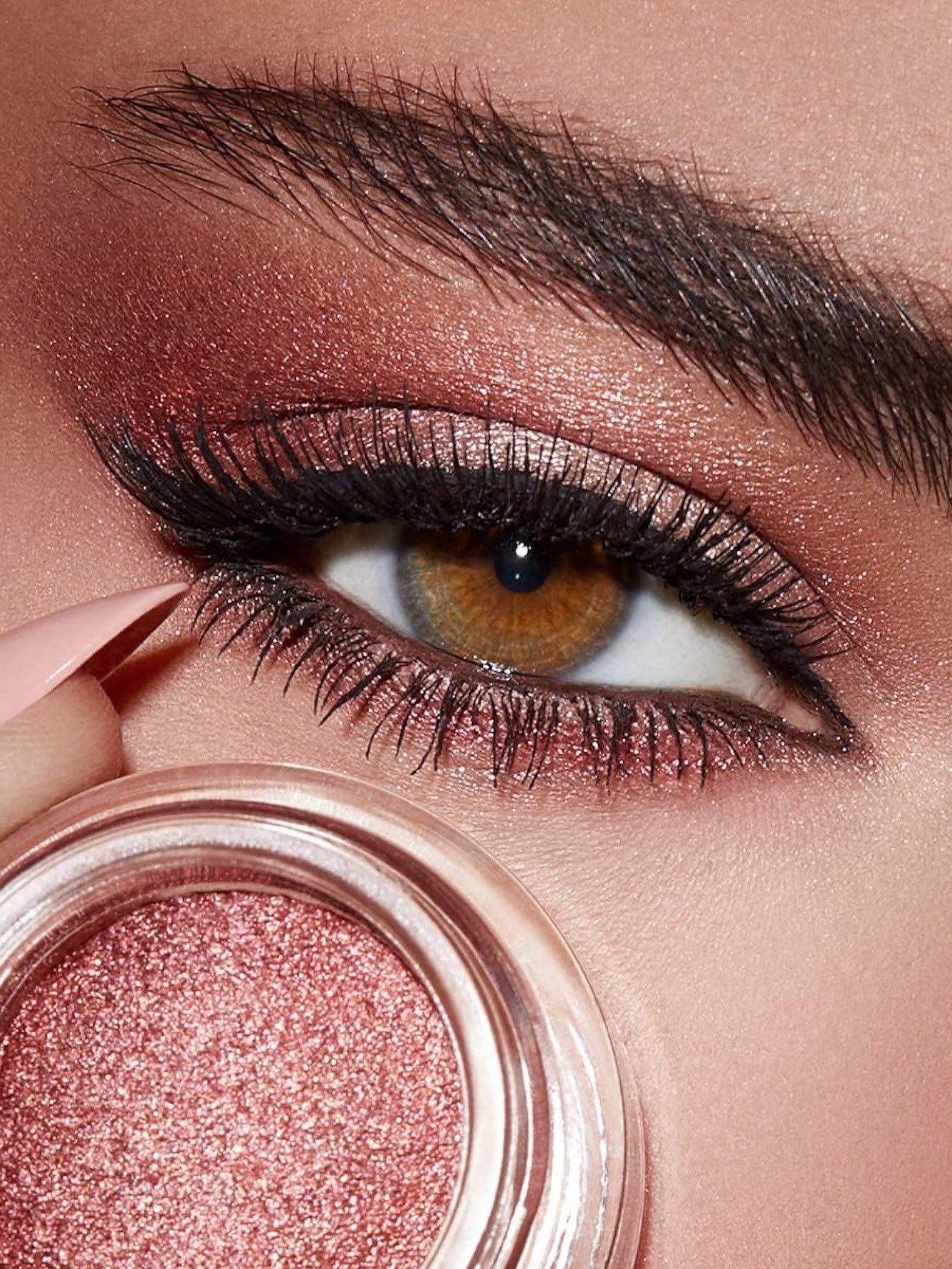 Close-up of a eye with makeup and a pink eyeshadow jar. Kiko Milano, Monza Outlet, Monza Fashion, Shein Outlet